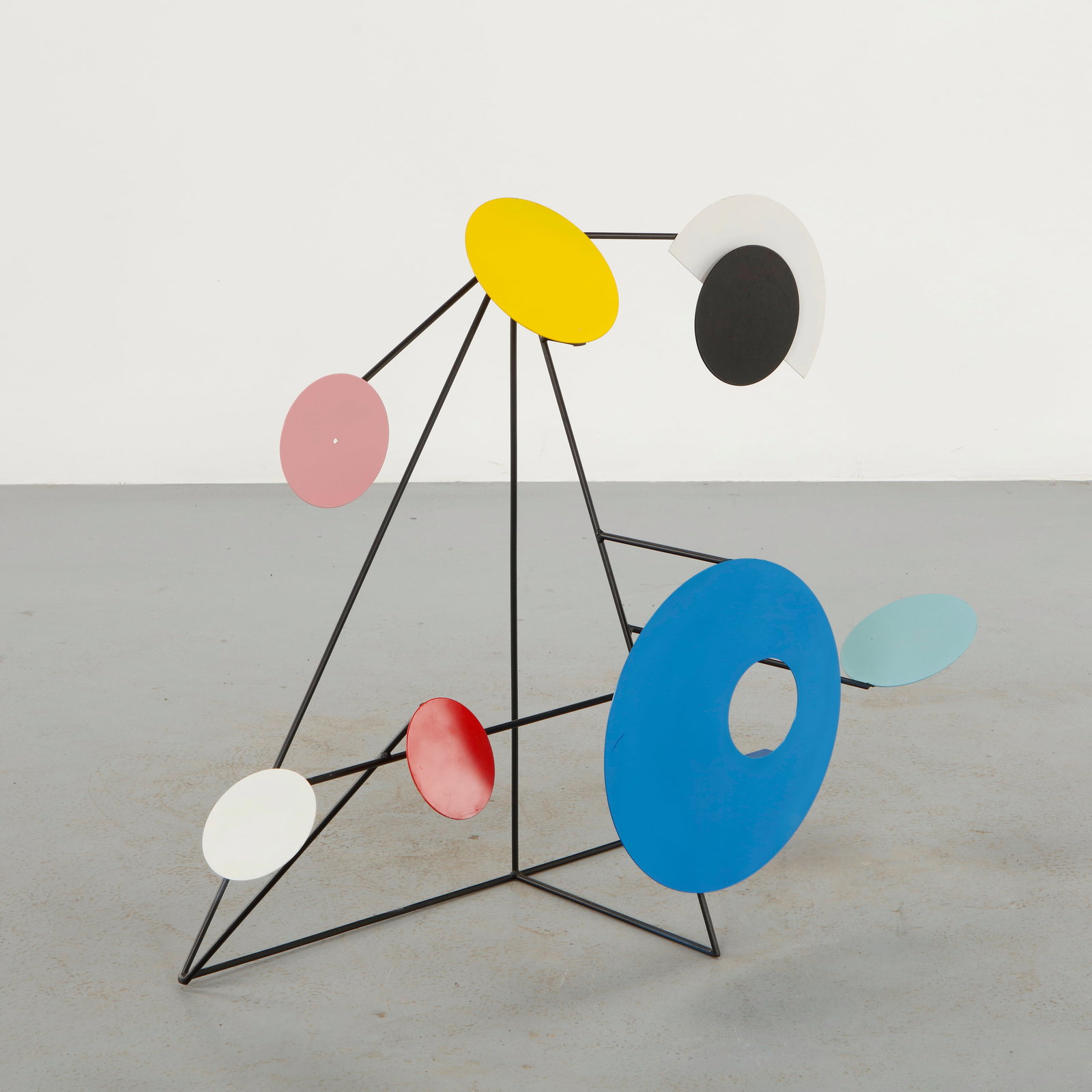 Postmodern Kinetic Standing Sculpture, 1980s: Constructed from slender black metal rods supporting colorful geometric discs and arcs, the sculpture evokes the dynamic balance of a modern mobile. The playful composition introduces movement and gra