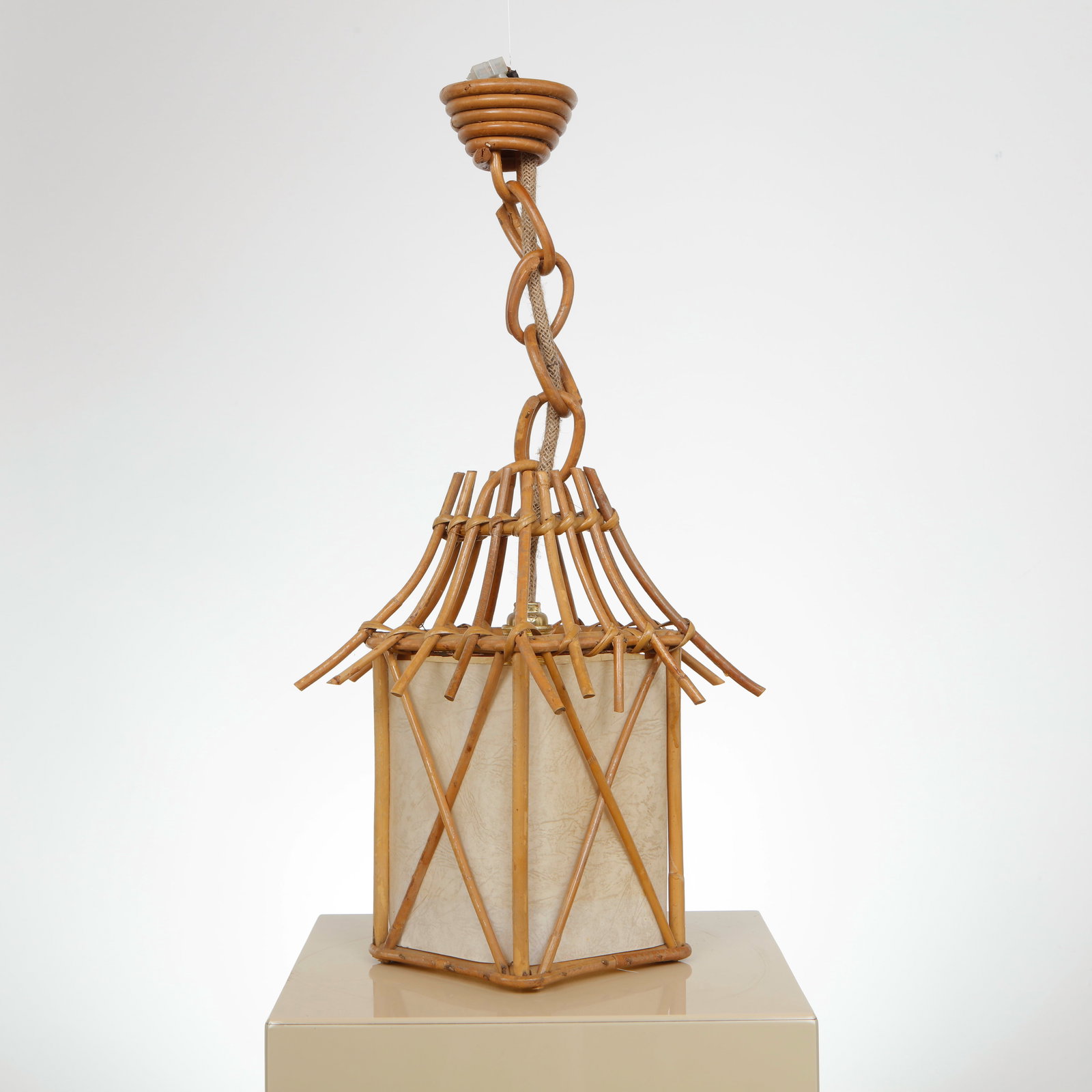 Louis Sognot, Light Fixture, 1960s: Suspension executed in rattan with an openwork structure surrounding a parchment shade. The composition highlights Sognot mastery of organic materials and his refined approach to light diffusion. Heig