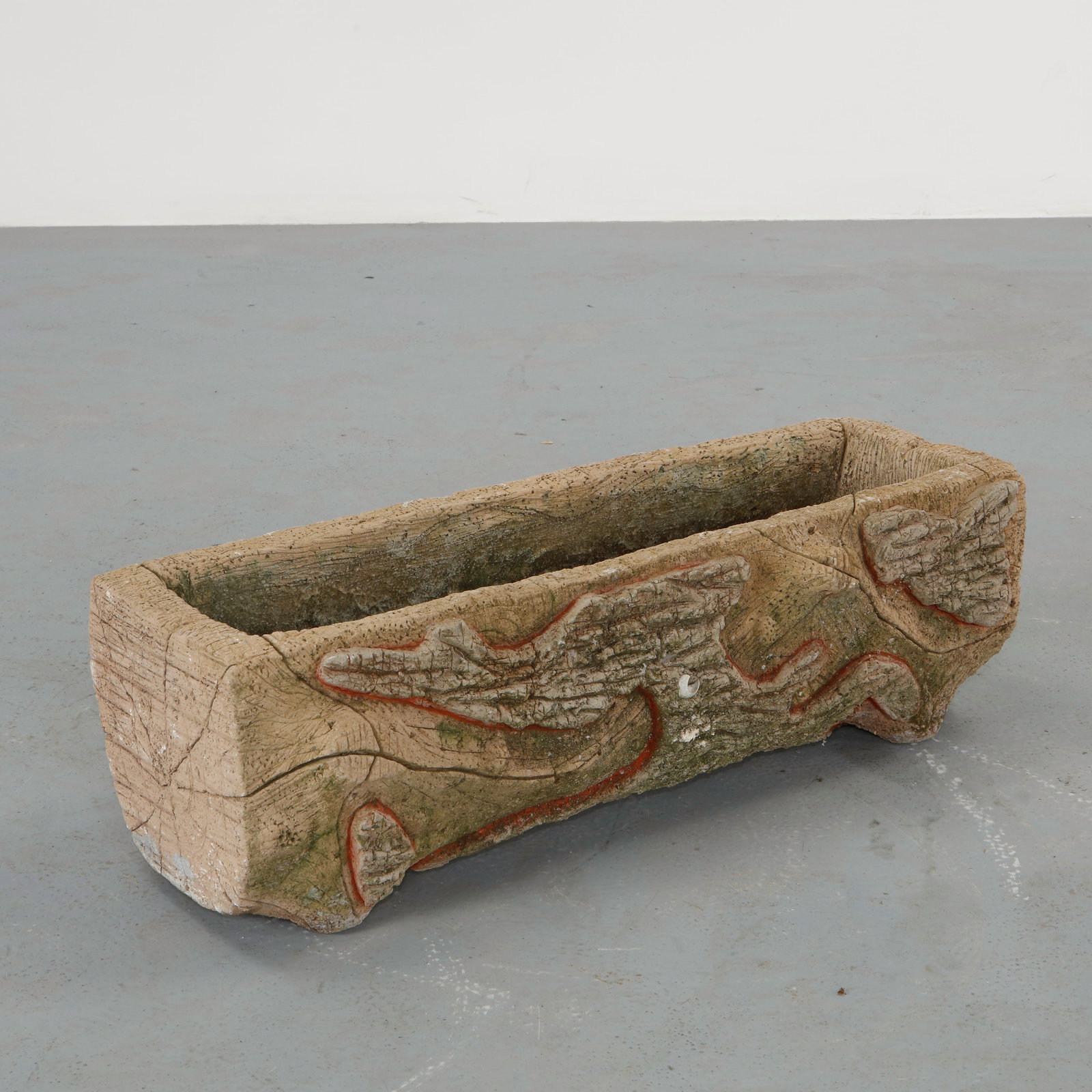 Faux Bois Log Planter, 1960s: Sculptural trough planter executed in cast concrete and carved in the faux bois tradition to evoke a natural tree trunk. The relief surface and organic contours highlight the craftsmanship of traditio