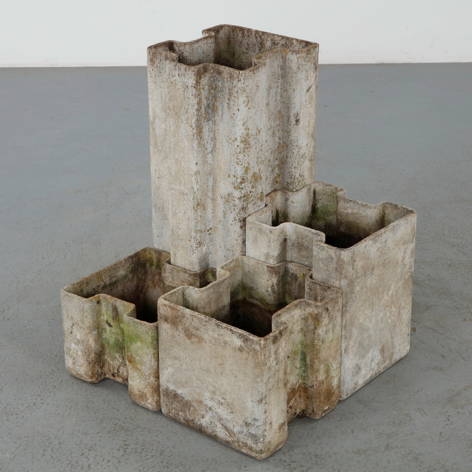 Willy Guhl, Set of Four Puzzle Piece Planters, 1960s: Executed in molded fiber cement, this rare suite of four modular planters by Willy Guhl features deeply architectural forms inspired by interlocking geometric volumes. The varied heights and sculptura