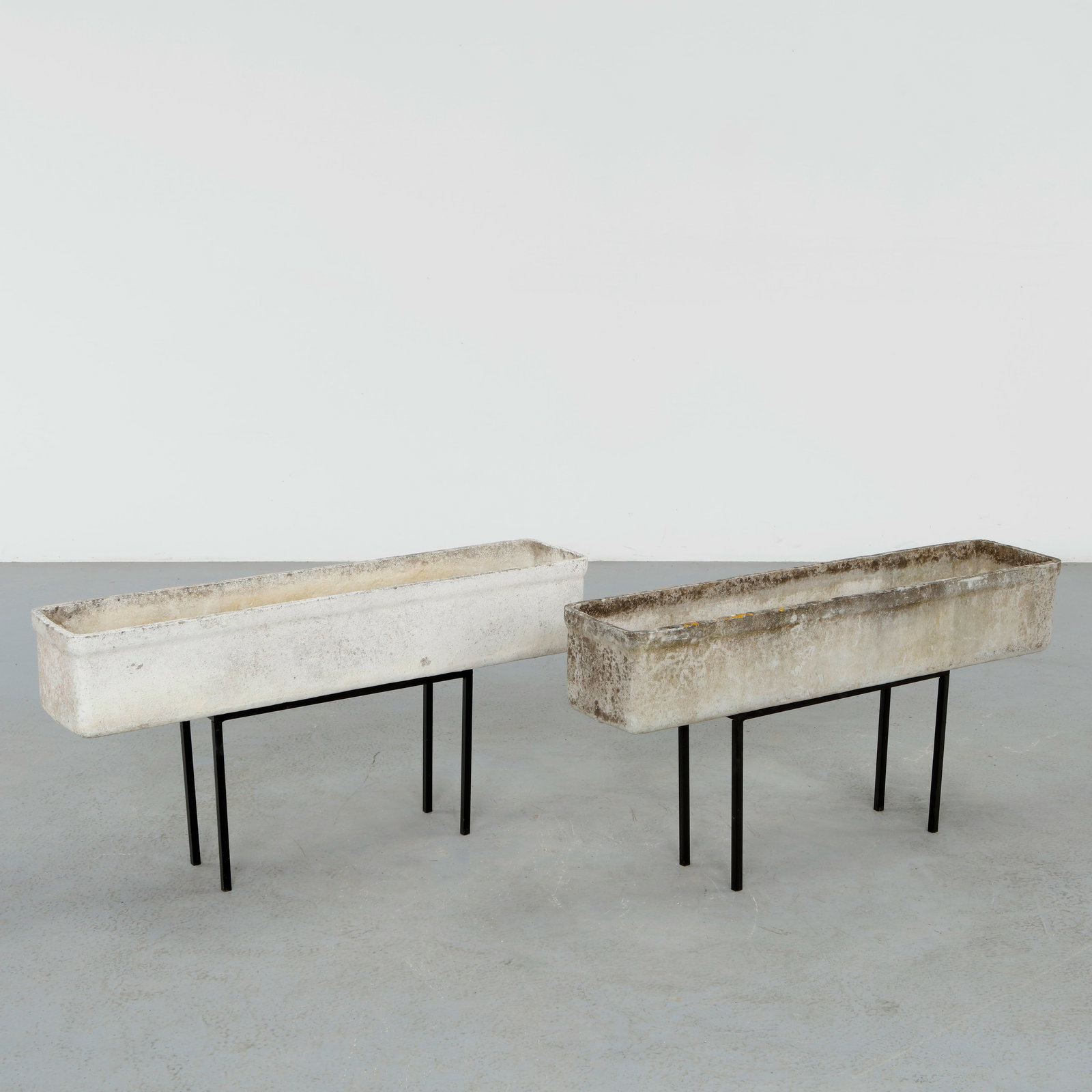 Willy Guhl, Pair of Rectangular Planters on Metal Stands, 1960s: Classic rectangular Eternit planters on metal stands designed by Willy Guhl. Timeless Swiss design with natural patina from outdoor use. Height: 19.5 in. Length: 39.25 in. Width: 8.25 in.