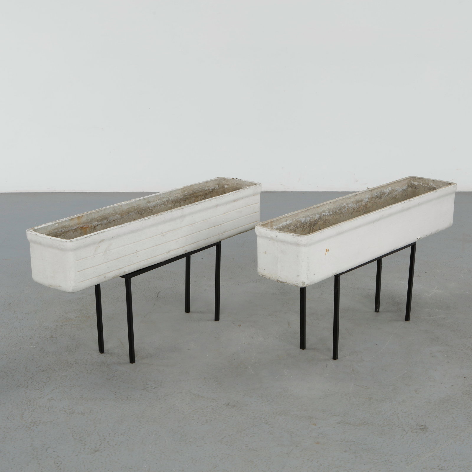 Willy Guhl, Pair of Rectangular Planters on Metal Stands, 1960s: Classic rectangular Eternit planters on metal stands designed by Willy Guhl. Timeless Swiss design with natural patina from outdoor use. Height: 19.5 in. Length: 39.25 in. Width: 8.25 in.