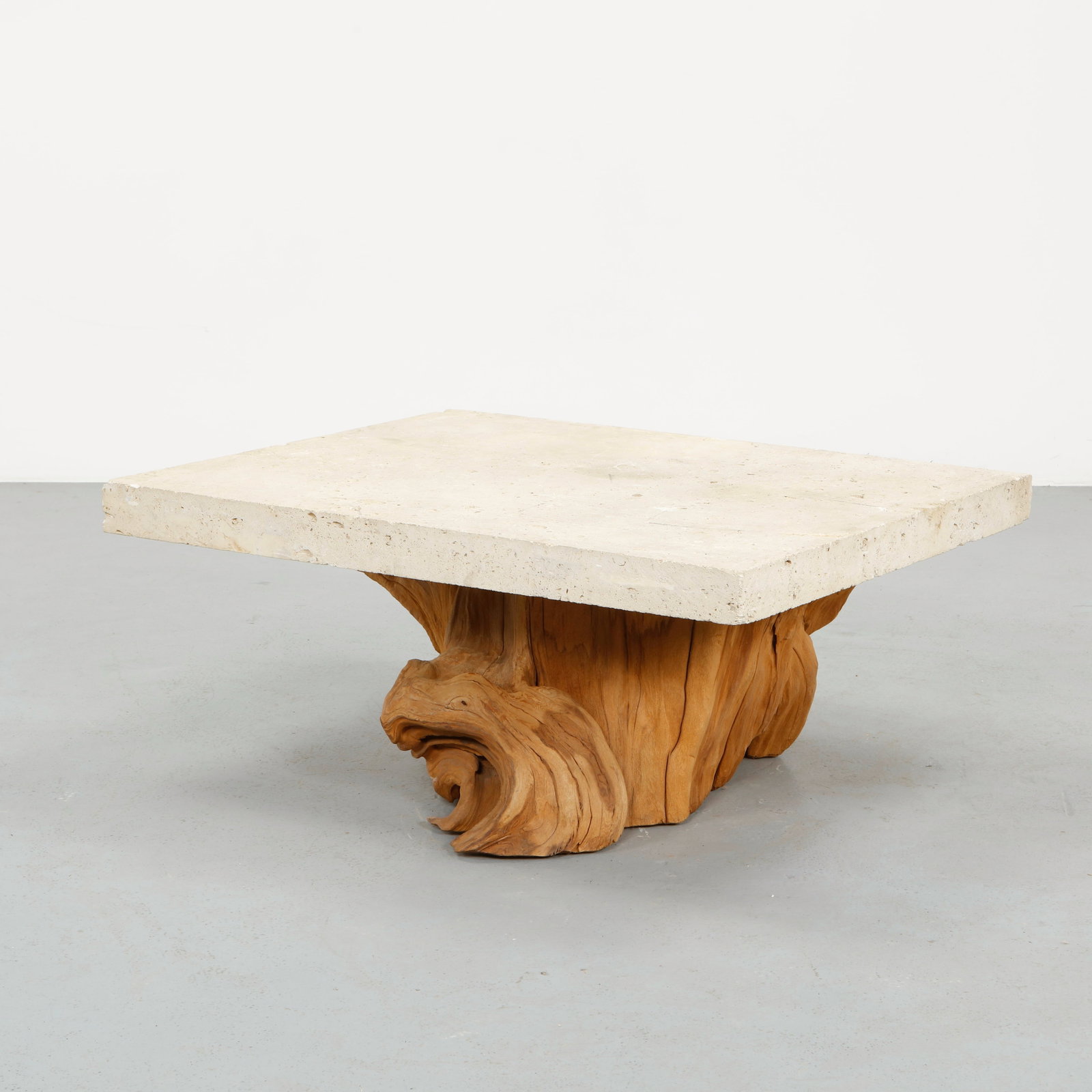 Stone and Root Coffee Table, 1970s: Selected by interior designer Steve Chase for the Toluca Lake residence of Bill Bowers, circa 1970s. A striking and poetic composition juxtaposing a thick stone slab with a naturally sculpted root bas