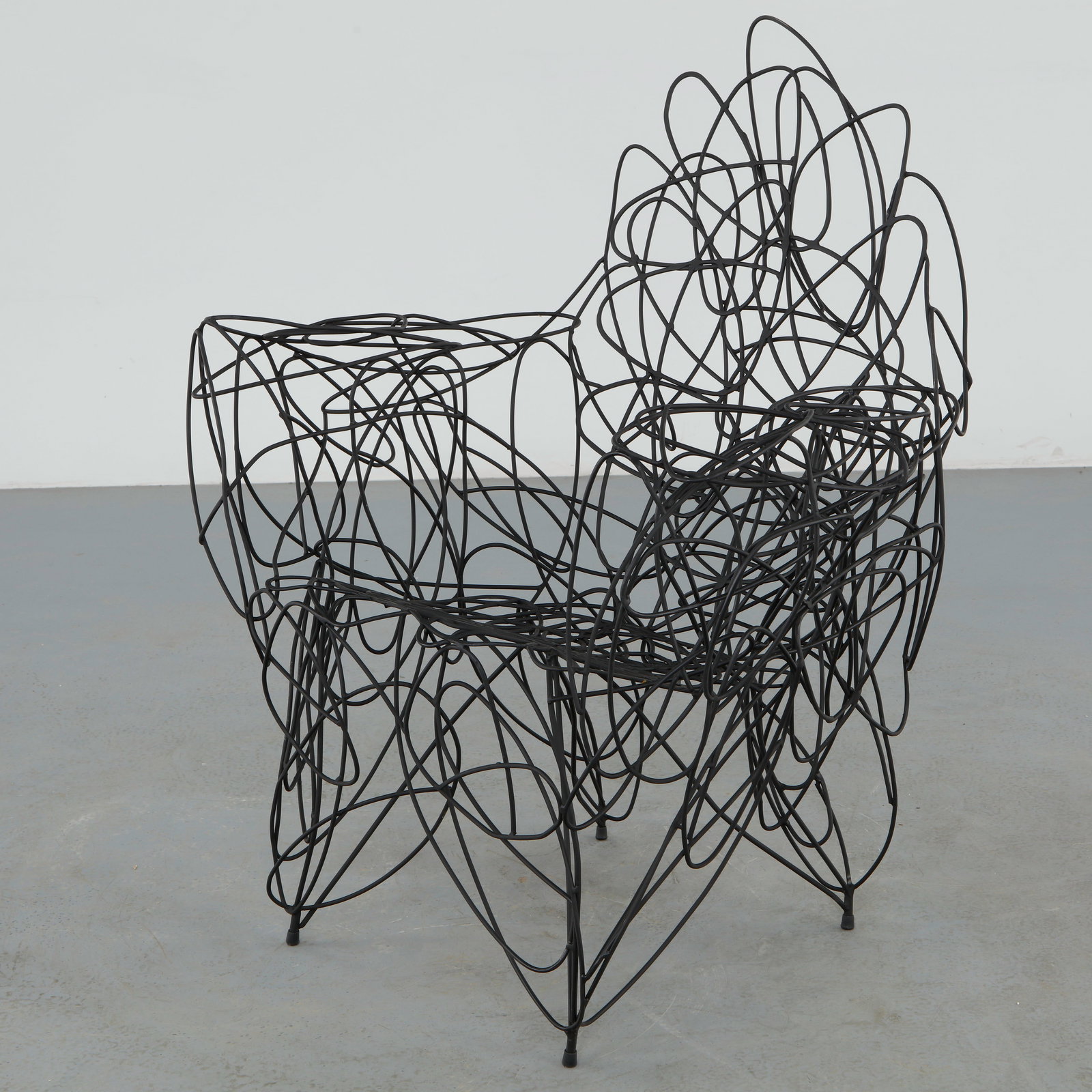 Philippe Makhloof, Sculptural Metal Chair, 1980s: Expressive sculptural chair by Philippe Makhloof formed from looping blackened metal rods creating an intricate openwork composition. The piece blurs the boundary between functional seating and contem