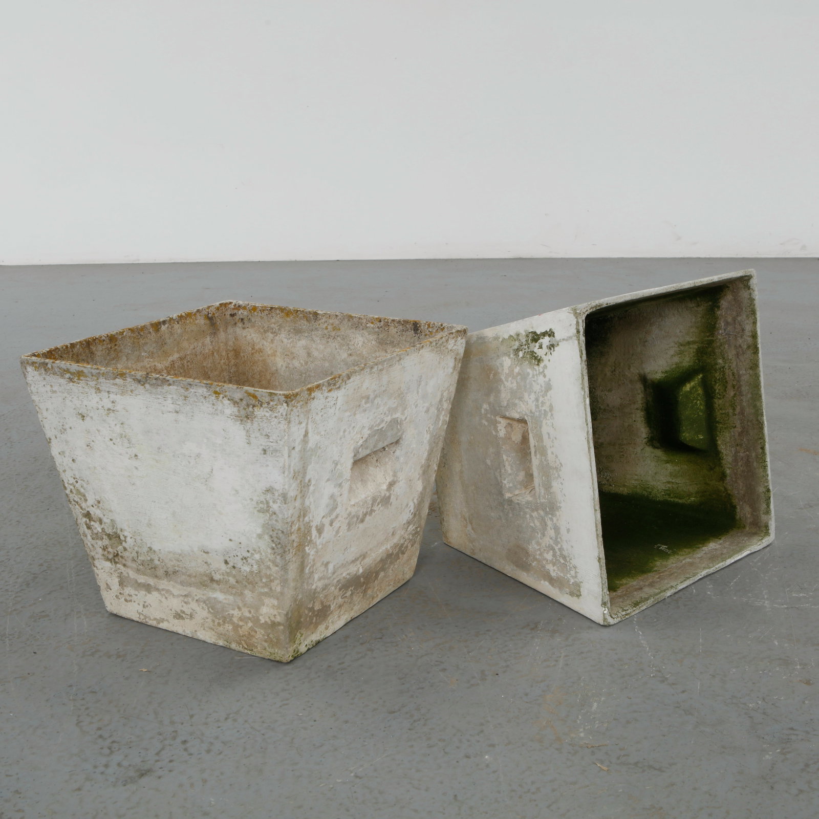 Willy Guhl, Pair of Graduated Square Planters, 1960s: Graduated square Eternit planters designed by Willy Guhl. Timeless Swiss design with natural patina from outdoor use. Height: 12 in. Length: 13.5 in. Width: 13.5 in.