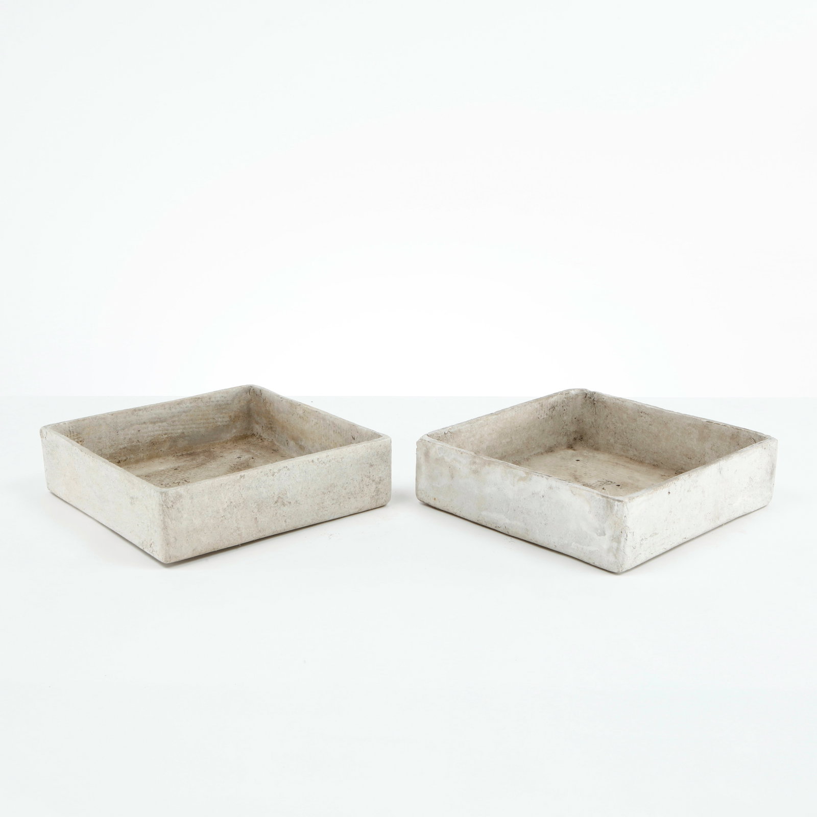 Willy Guhl, Pair of Square Tray Planters, 1960s: Rare pair of square Eternit planters designed by Willy Guhl, executed in fiber cement with clean geometric proportions and softened edges. Their restrained architectural form and naturally weathered s