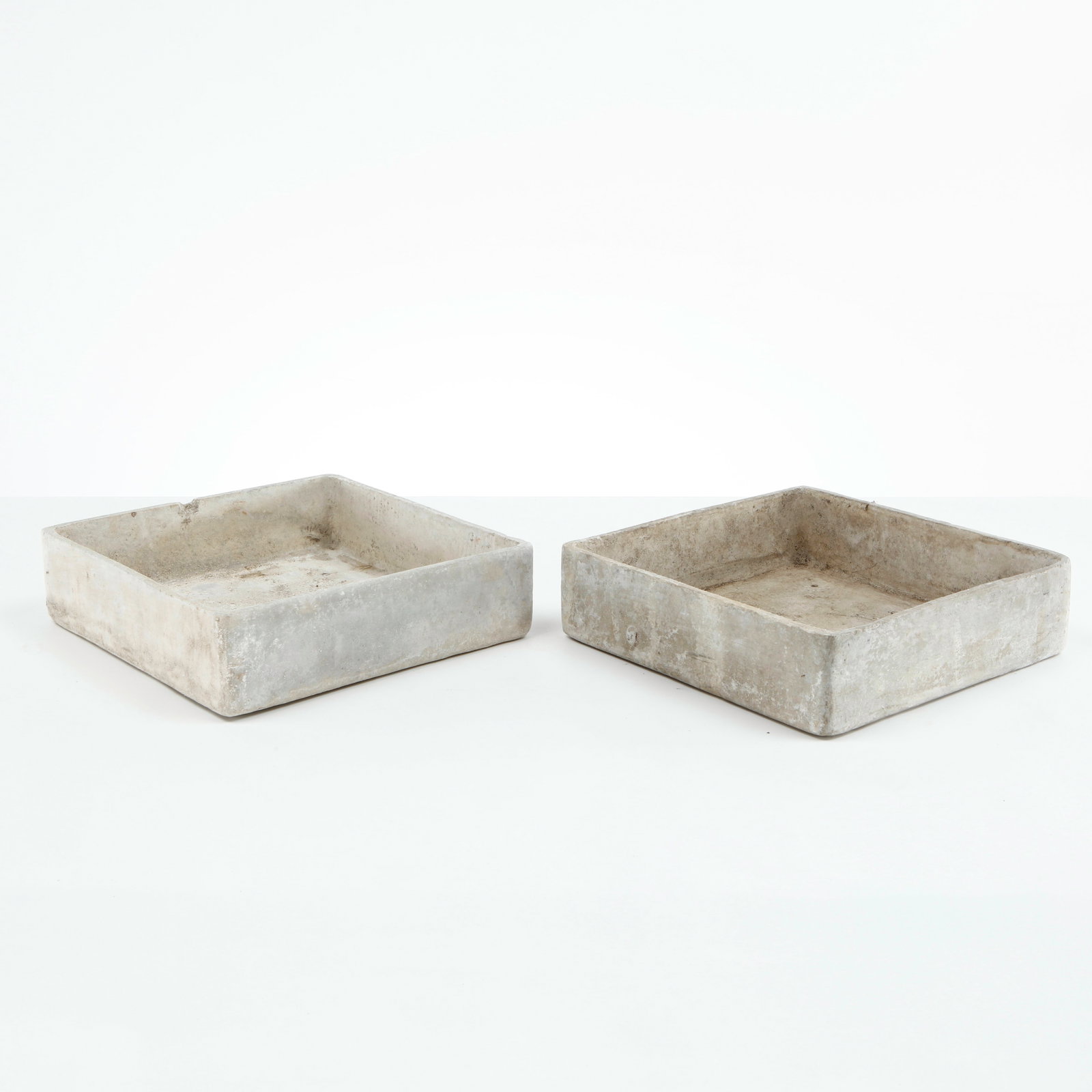 Willy Guhl, Pair of Square Tray Planters, 1960s: Rare pair of square Eternit planters designed by Willy Guhl, executed in fiber cement with clean geometric proportions and softened edges. Their restrained architectural form and naturally weathered s