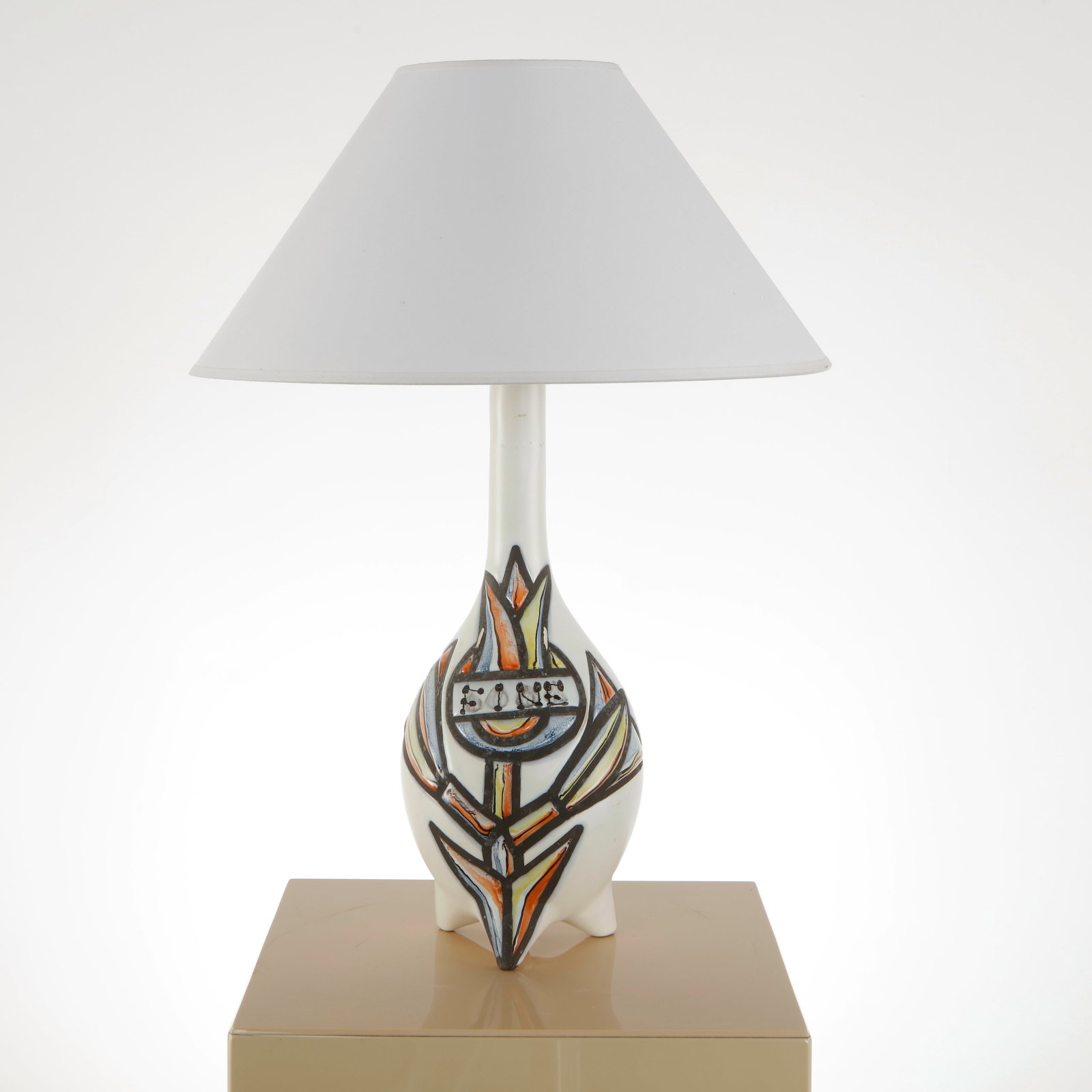 Roger Capron, Ceramic Table Lamp, 1960s: Executed in glazed ceramic, this lamp features a stylized geometric decoration characteristic of Capron work. The vivid motifs contrast elegantly with the refined silhouette. A decorative piece