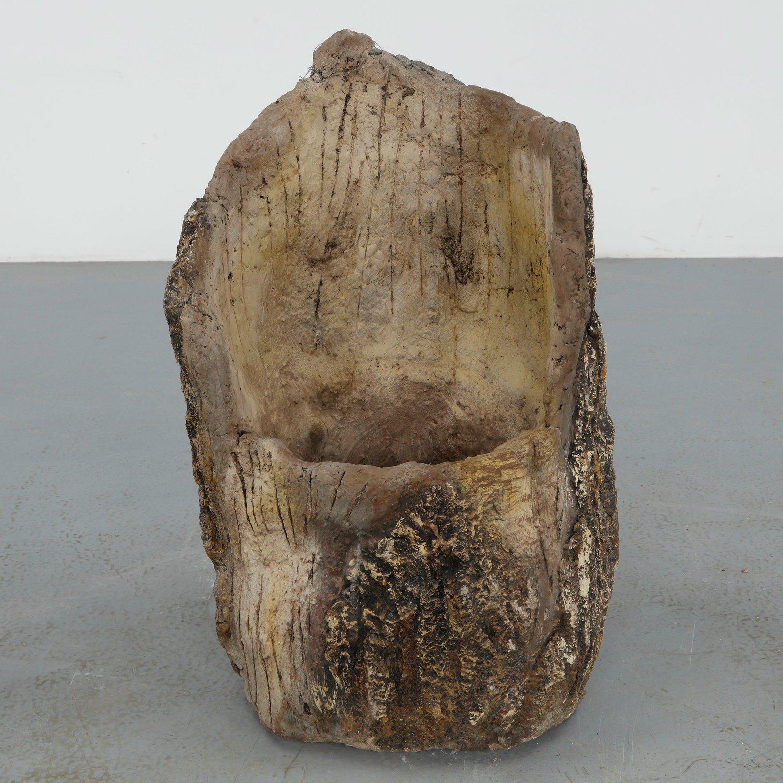 Large Faux Bois Round Planter, 1960s: A substantial round planter crafted in faux bois concrete, with a deeply textured surface imitating aged bark. Its generous scale and organic profile make it a commanding focal point in an outdoor