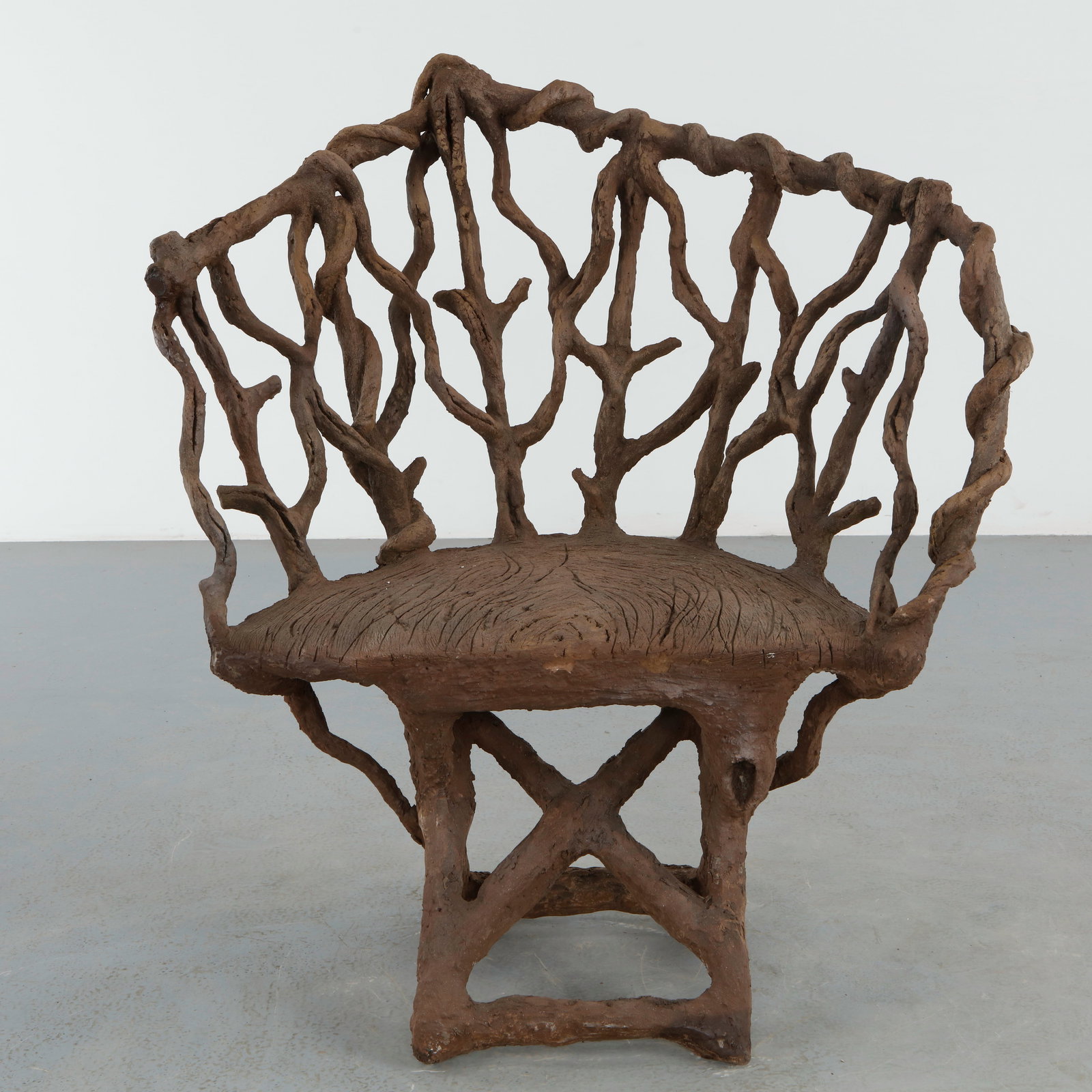 Organic Faux Bois Armchair: Organic faux bois armchair featuring a pierced branch form backrest and flowing sculptural silhouette. The handcrafted texture and asymmetrical composition lend the piece a poetic architectural presen