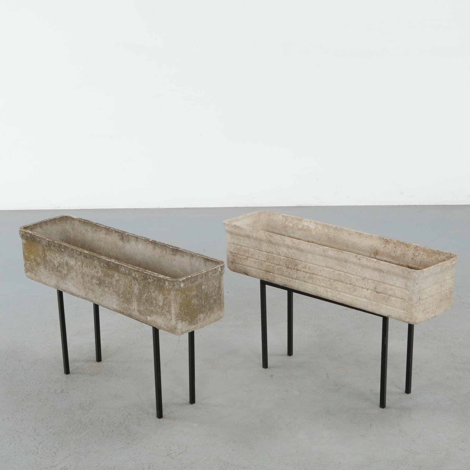 Willy Guhl, Pair of Rectangular Planters on Metal Stands, 1960s: Classic rectangular Eternit planters on metal stands designed by Willy Guhl. Timeless Swiss design with natural patina from outdoor use. Height: 19.5 in. Length: 31.75 in. Width: 8.5 in.