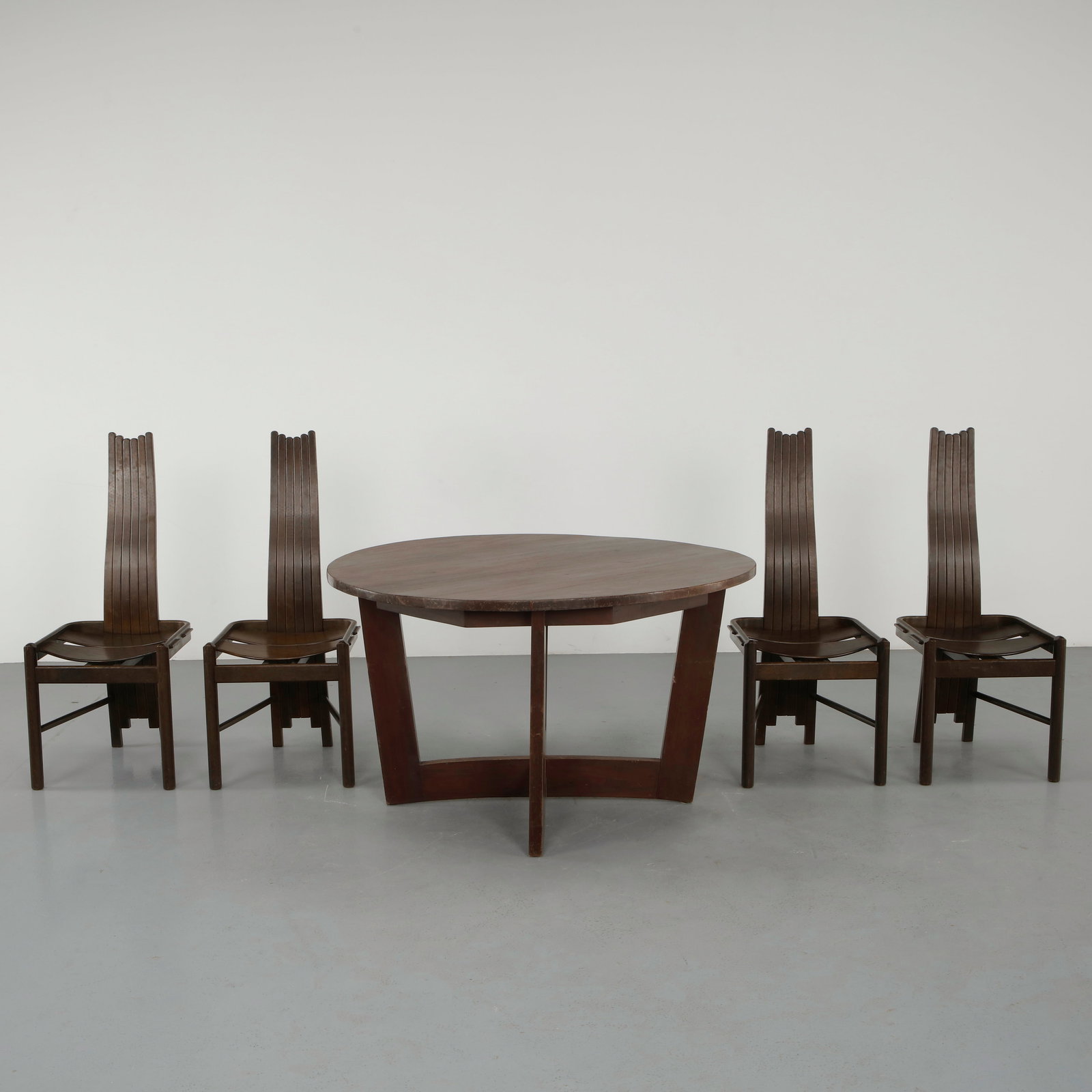 Allmilmo, Dining Set, 1980s: Crafted in wood, this dining set features clean lines and a refined modernist silhouette characteristic of late twentieth century design. The contrast between structure and surface creates a balanced 