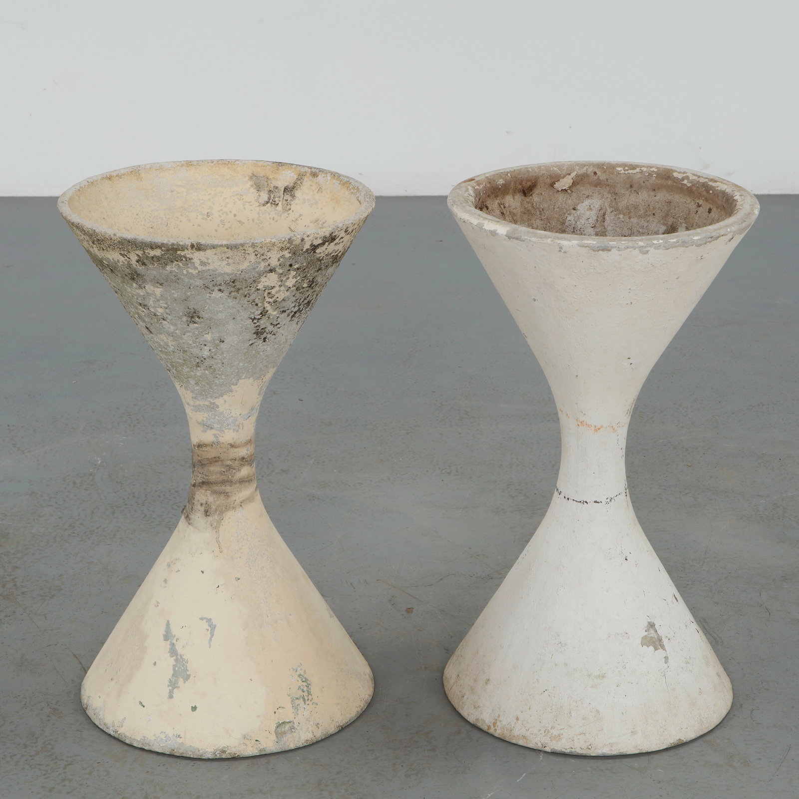 Willy Guhl, Pair of Small Diabolo Planters, 1960s: Classic fiber cement planters with fluted rims and medium scale. This pair typifies Willy Guhl utilitarian design elevated to art form. Height: 25 in. Diameter: 14.5 in.