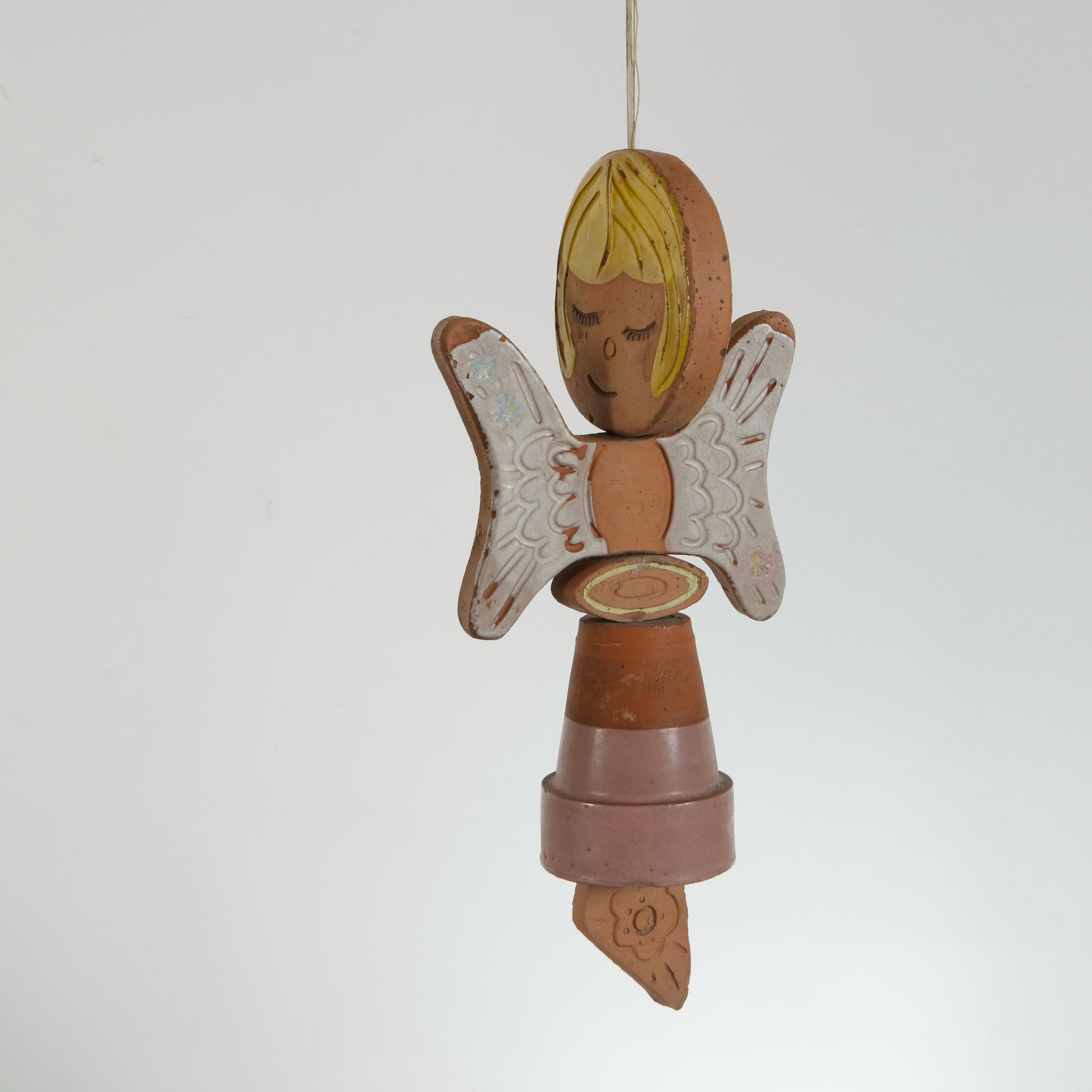 Mid-Century Ceramic Angel Mobile Ornament, 1960s: Decorative ceramic mobile ornament composed of sculptural geometric elements and a serene angel figure with closed eyes and stylized hair. A poetic example of midcentury decorative arts blending playf