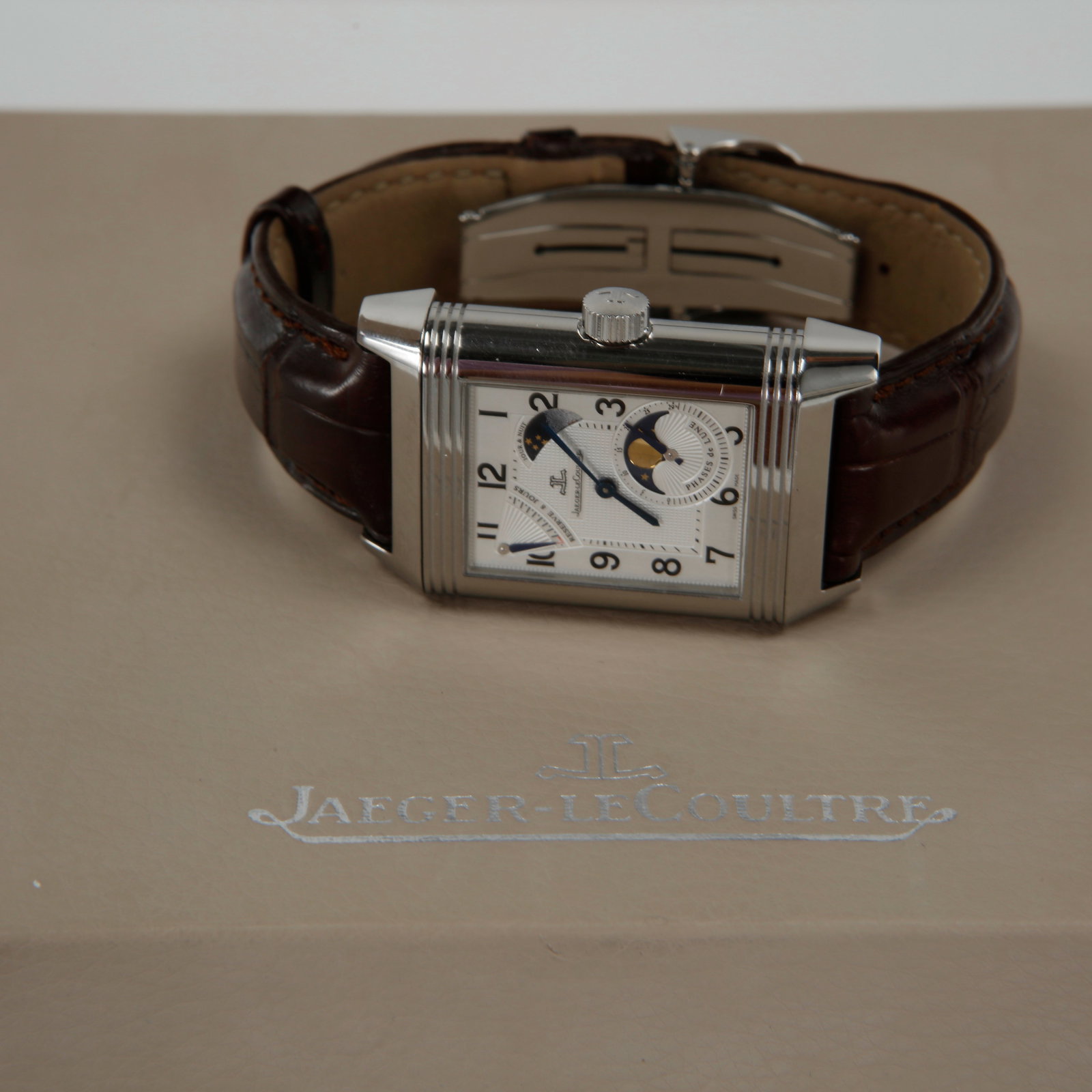 Jaeger-LeCoultre, Reverso Watch Model Grande Sun Moon, 2007: Reverso Grande Sun Moon. A stainless steel reversible wristwatch with moon phases, date and night and power reserve indication. The watch was acquired in 2007 and is offered with its original box and 