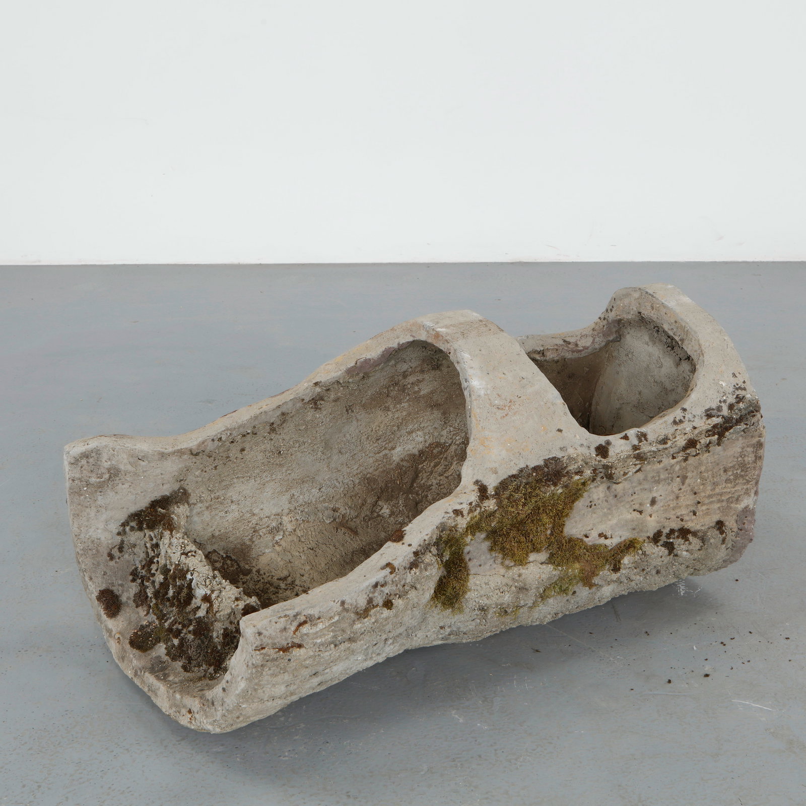 Monumental Faux Bois Log Planter, 1960s: Rare faux bois planter sculpted to resemble a natural tree trunk with a deeply carved planting reserve. Executed in concrete with richly textured surfaces and organic contours, the piece features an e