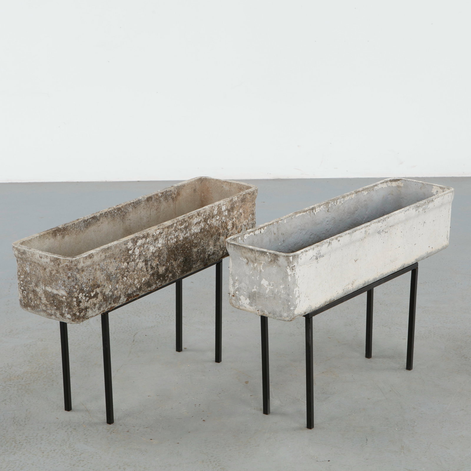 Willy Guhl, Pair of Rectangular Planters on Metal Stands, 1960s: Classic rectangular Eternit planters on metal stands designed by Willy Guhl. Timeless Swiss design with natural patina from outdoor use. Height: 19.5 in. Length: 31.25 in. Width: 8.5 in.