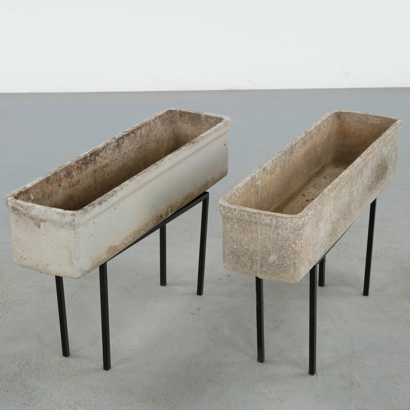 Willy Guhl, Pair of Rectangular Planters on Metal Stands, 1960s: Classic rectangular Eternit planters on metal stands designed by Willy Guhl. Timeless Swiss design with natural patina from outdoor use. Height: 19.5 in. Length: 31 in. Width: 8.5 in.