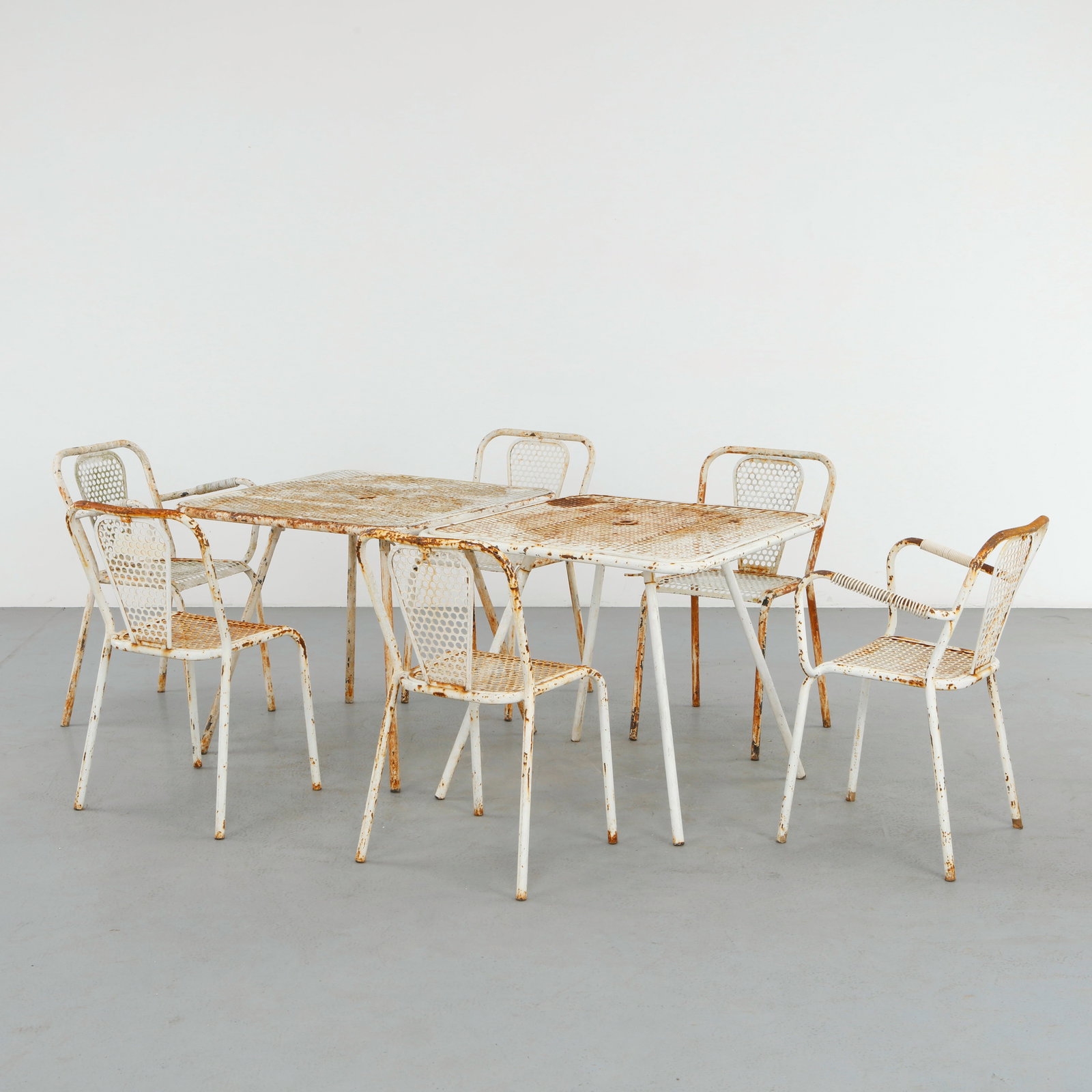 Rene Malaval, Outdoor Perforated Metal Dining Set, 1950s: Rare French outdoor dining set by Rene Malaval, executed in perforated lacquered metal with elegantly curved silhouettes characteristic of postwar garden design. The ensemble retains a richly weathere
