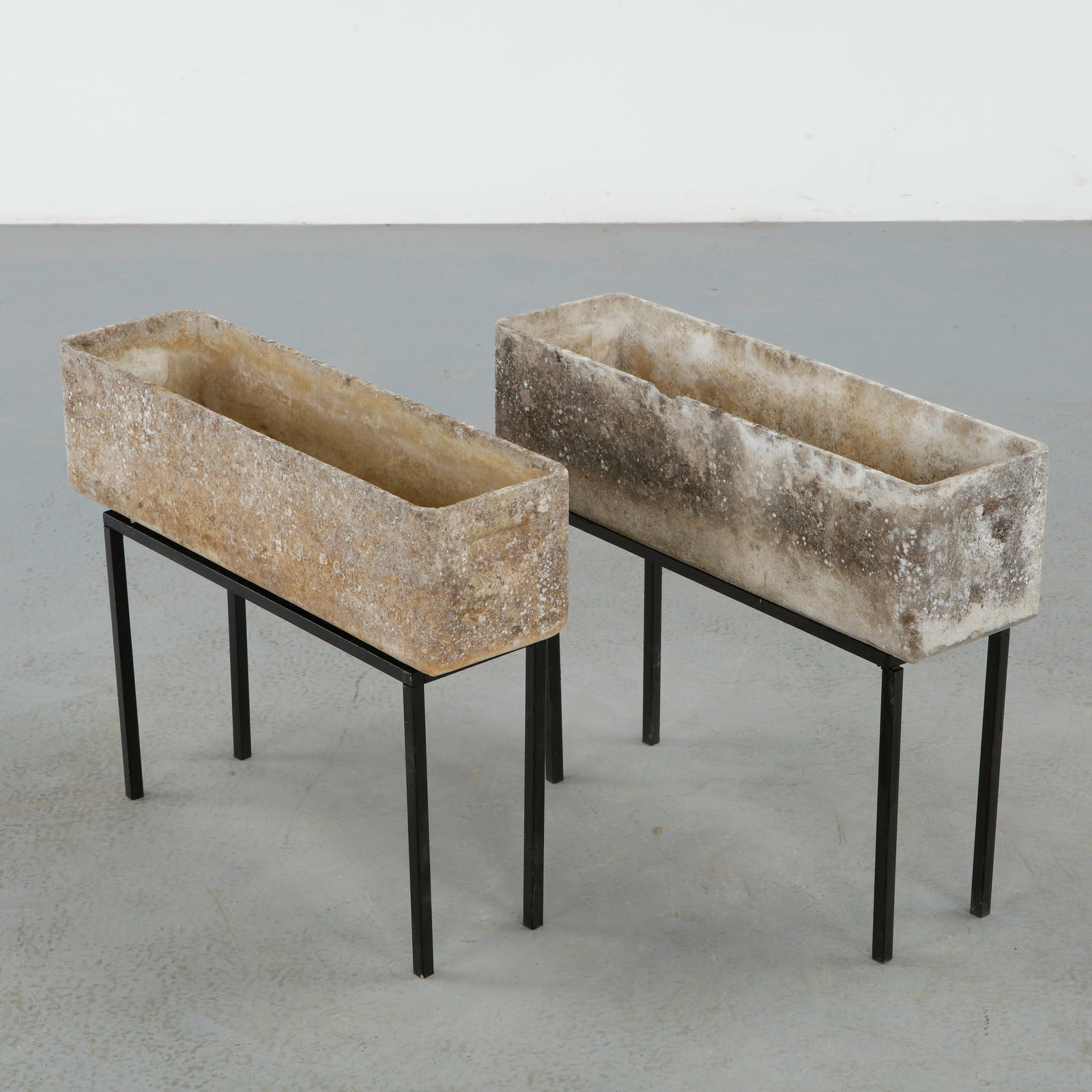 Willy Guhl, Pair of Rectangular Planters on Metal Stands, 1960s: Classic rectangular Eternit planters on metal stands designed by Willy Guhl. Timeless Swiss design with natural patina from outdoor use. Height: 19 in. Length: 24 in. Width: 7 in.