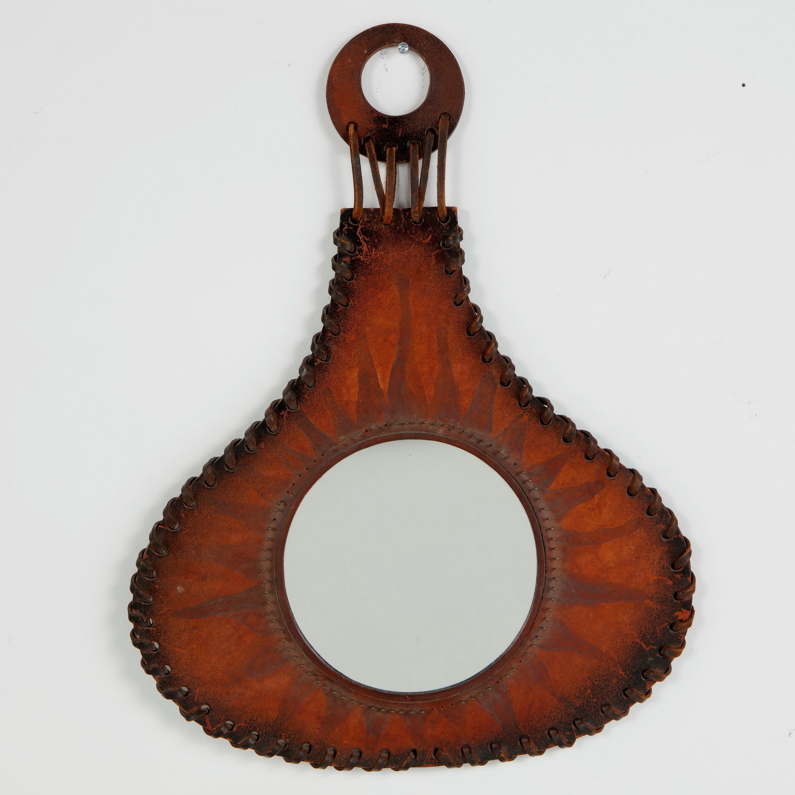 Farkas Klara, Leather Mirror, 1970s: Mirror framed in stitched leather panels, showcasing artisanal craftsmanship and tactile richness. A distinctive piece combining functionality with the refined materiality of midcentury design.