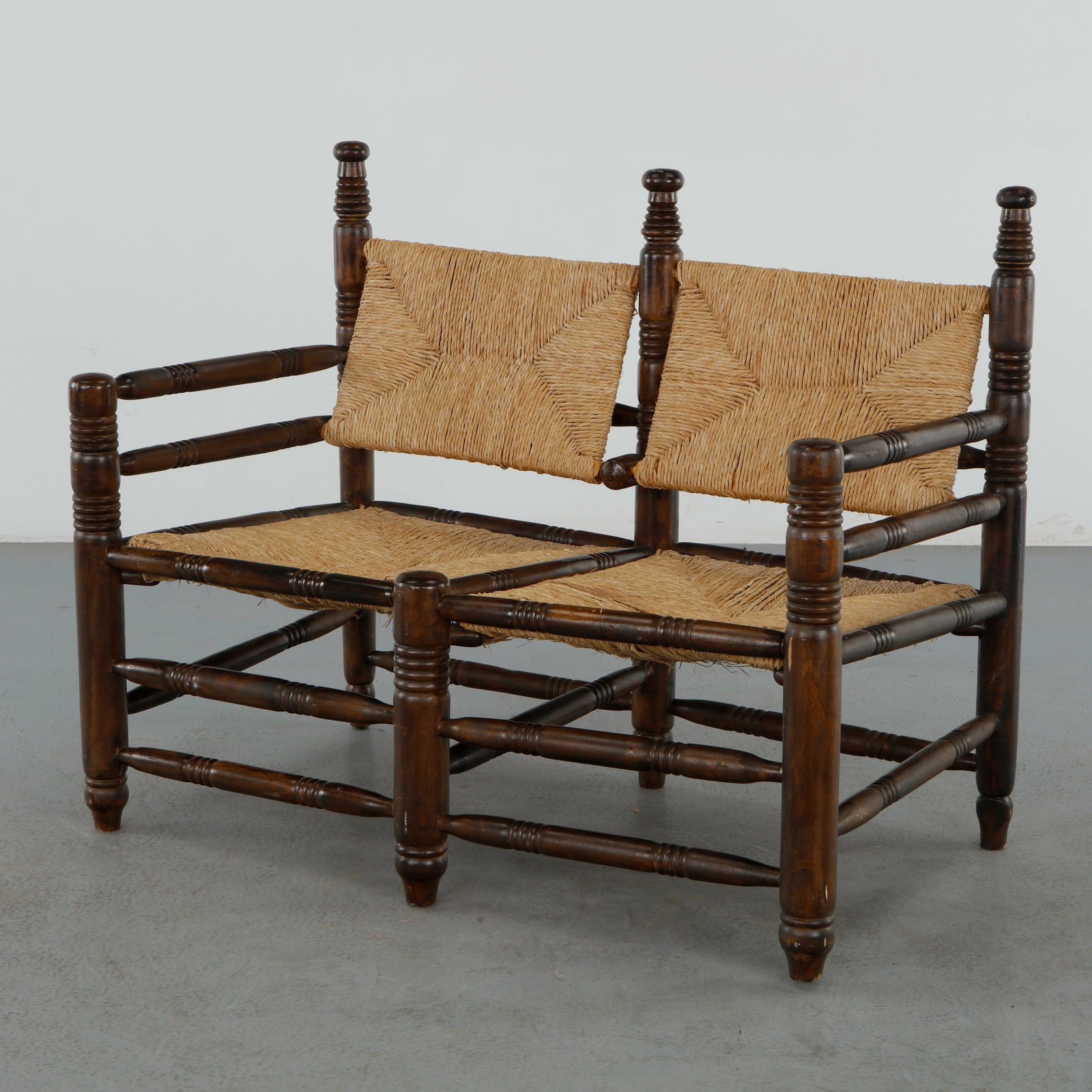 Charles Dudouyt, Rope and Wood Bench, 1940s: Crafted in solid wood with a woven rope seat, the bench features turned elements and a robust linear frame. A refined example of Dudouyt rustic modern aesthetic. Height: 35 in. Width: 42.5 in. Depth: