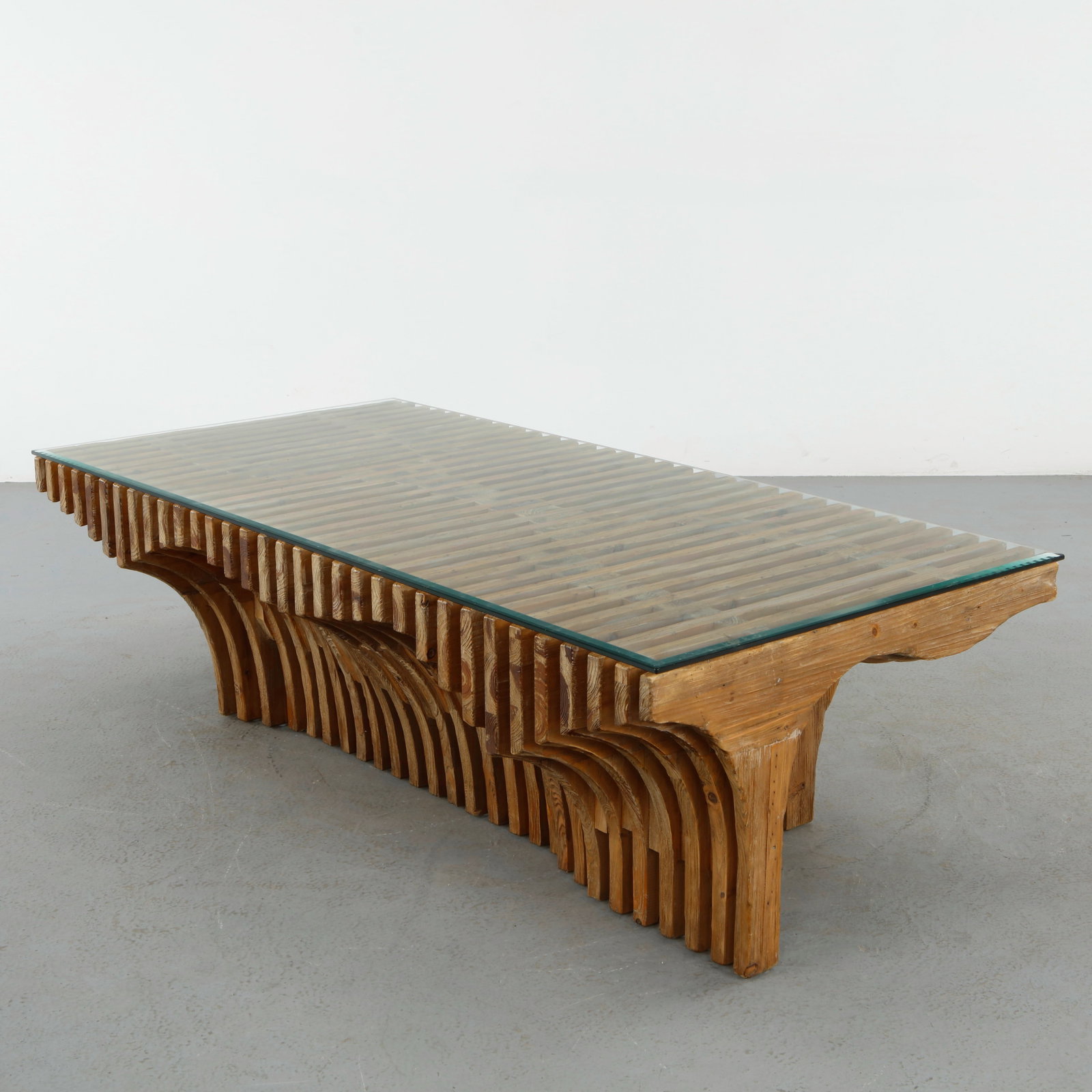 Berman Rosetti for Mimi London Arroyo Sculptural Oak & Glass Waterfall Coffee Table, Commissioned: Large scale brutalist coffee table crafted from layered solid wood slats supporting a floating glass top. The rhythmic architectural base and warm natural grain showcase the sculptural vocabulary asso