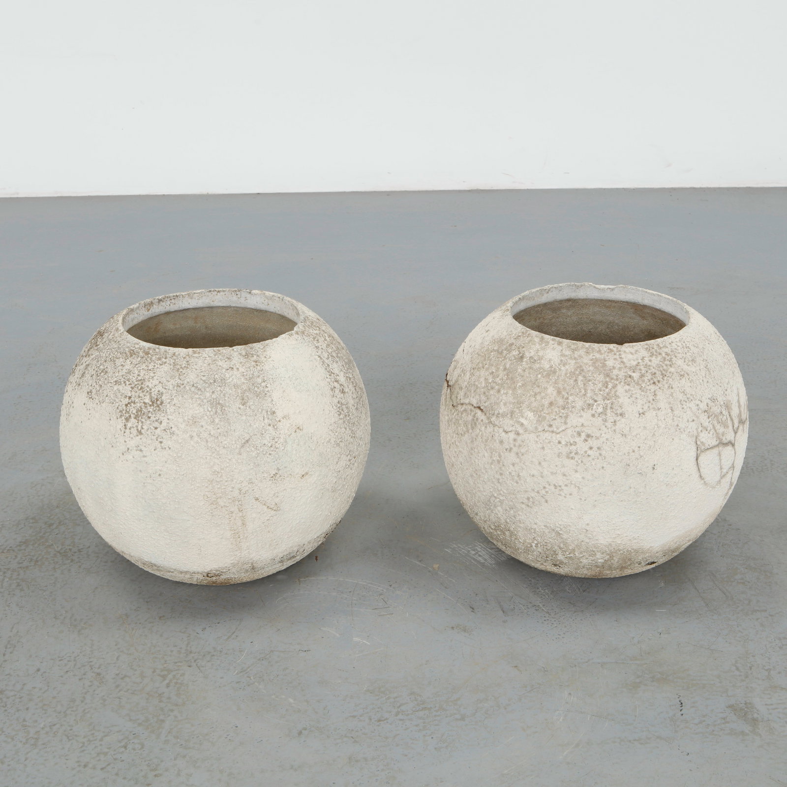 Grandon Fres, Pair of Large Spherical Planters, 1960s: Pair of large spherical shaped planters by Grandon Fres. Each displays subtle variations in surface texture and tone from age. Height: 14.5 in. Diameter: 17 in. Opening Diameter: 9.5 in.