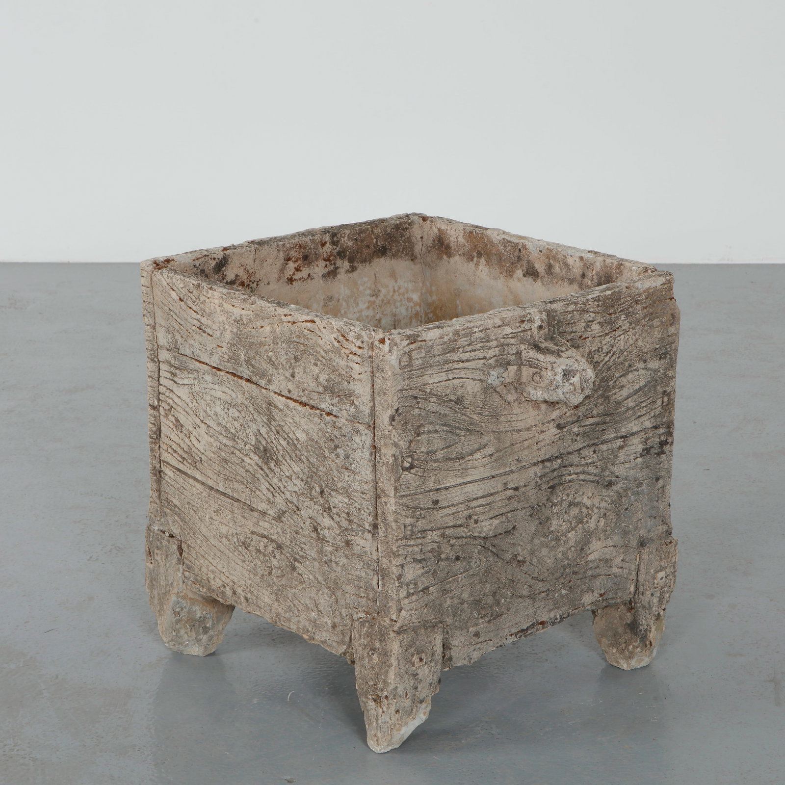 Rectangular Faux Bois Planter, 1960s: Cast in textured concrete imitating the grain of natural wood, this rectangular planter reflects the enduring tradition of French faux bois garden ornament. The sculpted surface and aged patina lend