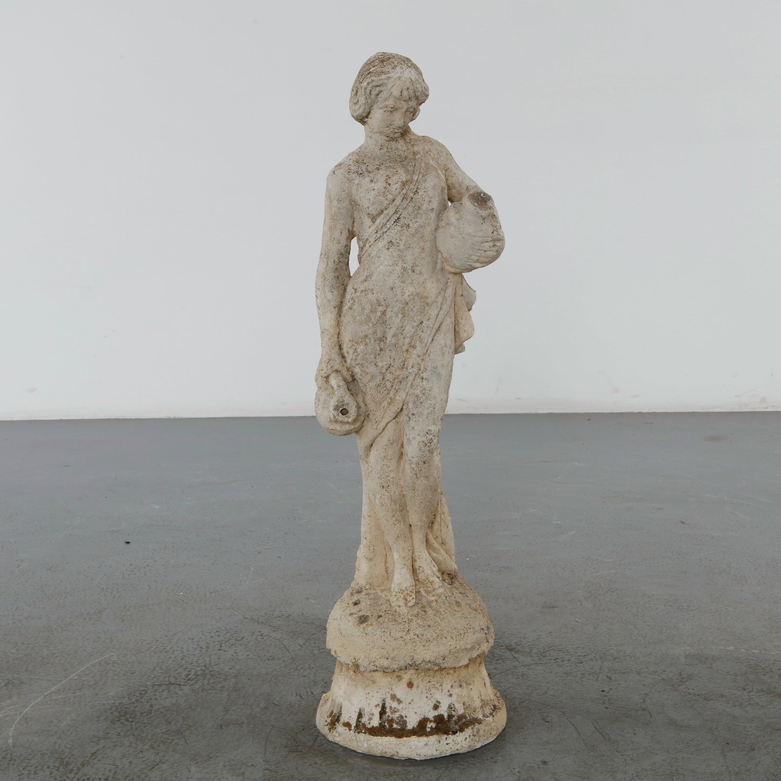 Classical Garden Statue of a Maiden Fountain, 1960s: A graceful cast concrete garden fountain depicting a classical maiden holding water vessels, executed in a timeless neoclassical style. Featuring a beautifully weathered patina and original plumbing