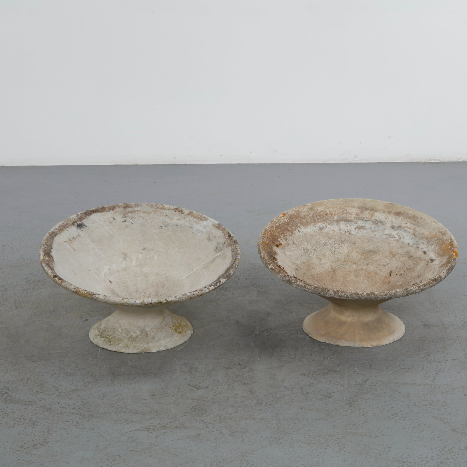Willy Guhl, Pair of Off-Kilter Planters, 1960s: A pair of rare asymmetrical planters by Willy Guhl, featuring a bold modernist design. Height: 14.5 in. Diameter: 25 in.