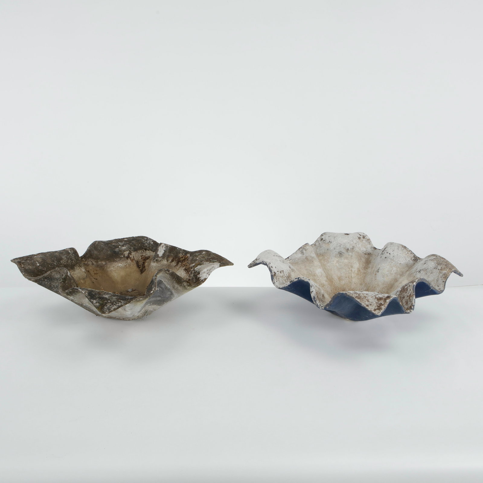 Willy Guhl, Pair of Small Elephant Ear Planters, 1960s: Pair of Small Elefantenohr Elephant Ear planters, also known as handkerchief planters, by Willy Guhl for Eternit, Switzerland circa 1960. Factory-drilled drainage holes. Wonderful patina. Width: 19