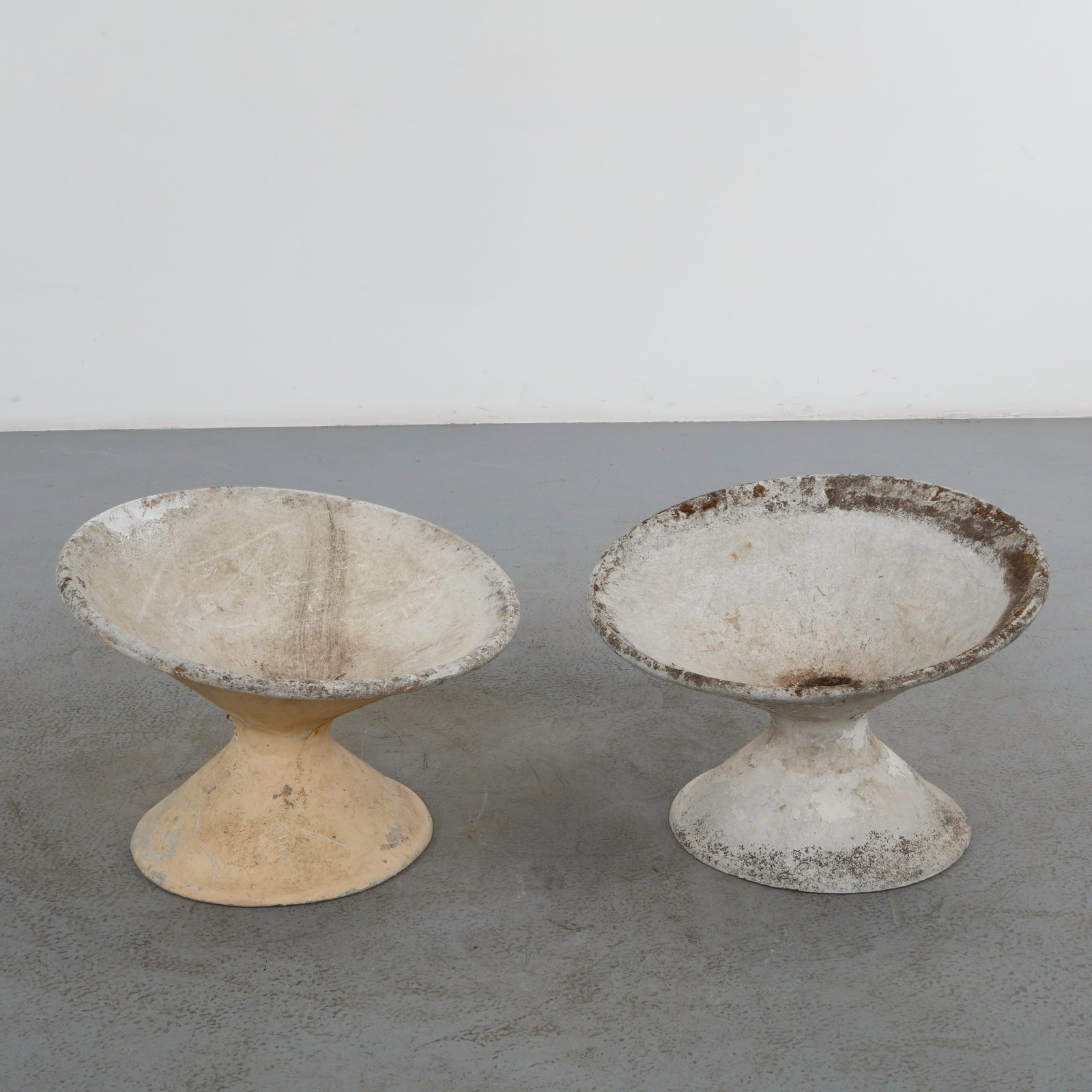 Willy Guhl, Pair of Off-Kilter Planters, 1960s: A pair of rare asymmetrical planters by Willy Guhl, featuring a bold modernist design. Height: 18 in. Diameter: 25 in.