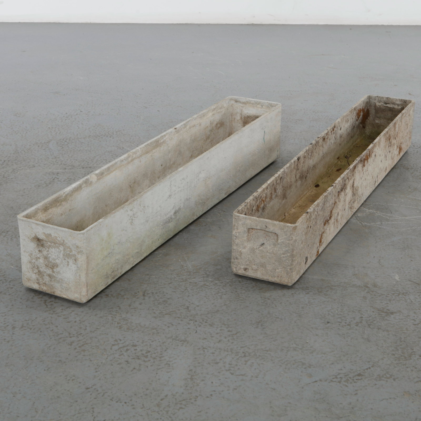 Willy Guhl, Pair of Rectangular Planters, 1960s: Classic rectangular Eternit planters designed by Willy Guhl. Timeless Swiss design with natural patina from outdoor use Height: 6 in. Length: 39 in. Width: 6.5 in. Taller: Height: 7 in. Length: 39 in.