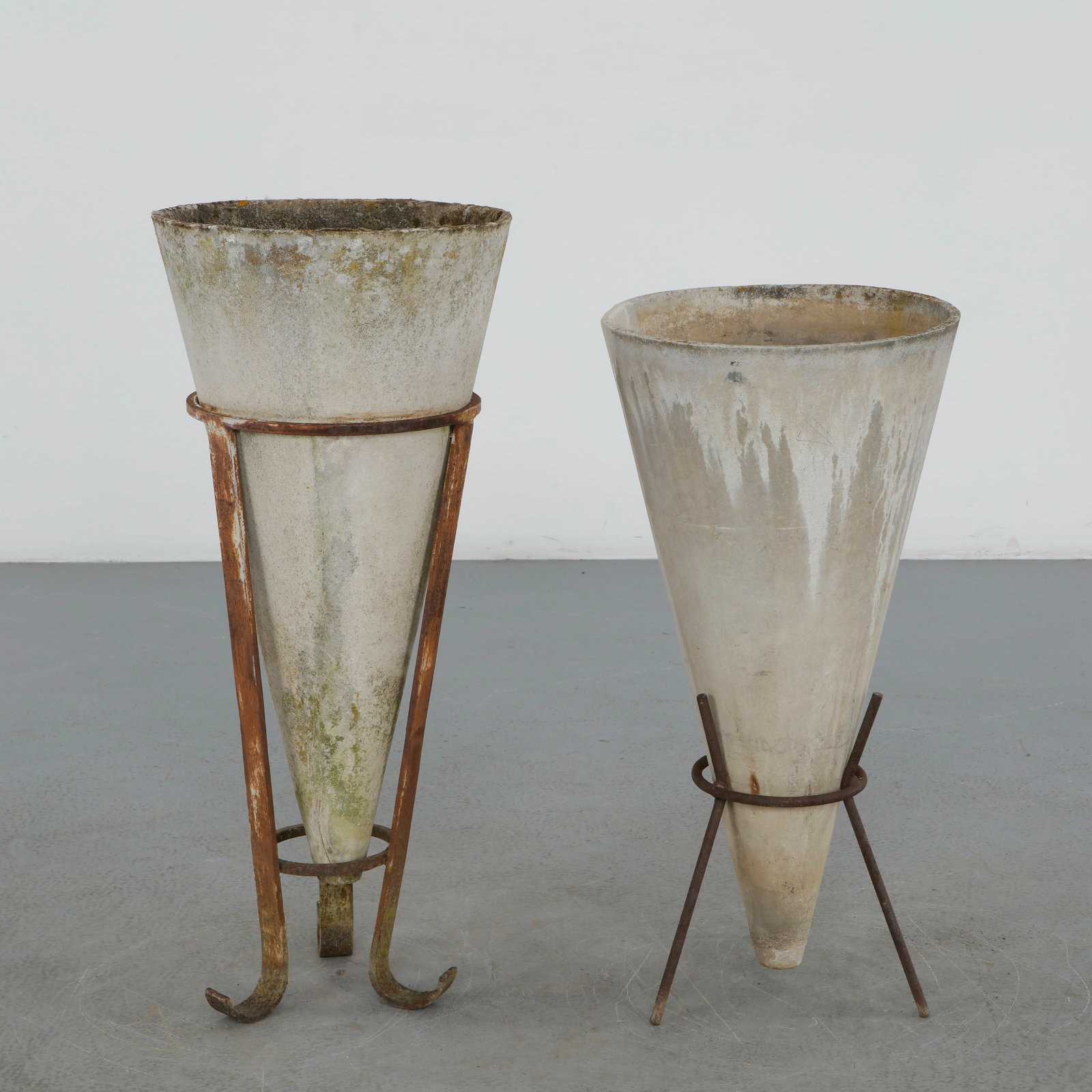Willy Guhl, Pair of Conical Planters on Metal Stands, 1960s: Designed by Willy Guhl for Eternit, this pair of conical fiber cement planters rests on minimalist metal stands. Their elegant proportions, sculptural silhouettes, and naturally weathered surfaces exe
