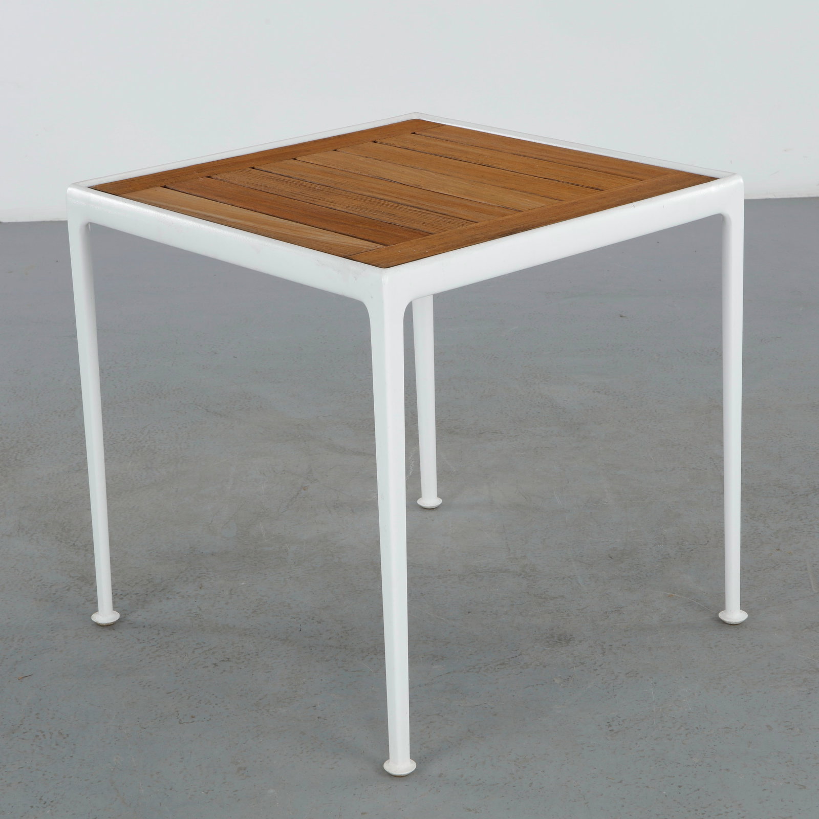 Richard Schultz for Knoll, 1966 Collection Side Table: A small square outdoor table from the 1966 Collection, its slatted teak top set within a white powder-coated aluminum frame on slender tapering legs.