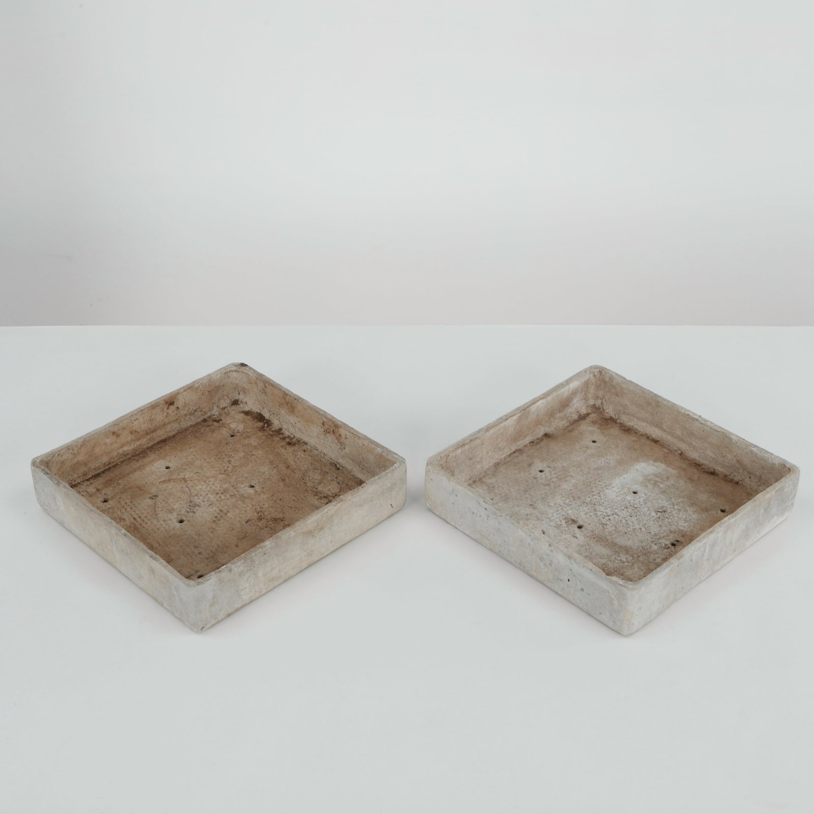 Willy Guhl, Pair of Square Tray Planters, 1960s: Rare pair of square Eternit tray planters designed by Willy Guhl, executed in fiber cement with clean geometric proportions and softened edges. Their restrained architectural form and naturally weathe
