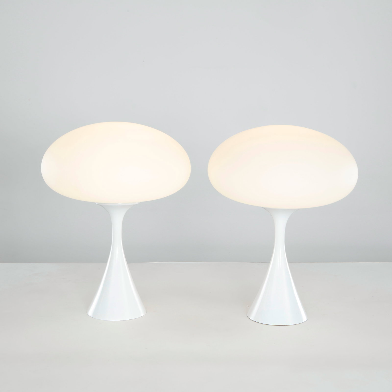 Laurel Lamp Company, Mushroom Table Lamp, 1960s: Pair of mushroom table lamps by Laurel Lamp Company, combining sculptural silhouettes with softly illuminated opaline shades. Their minimalist elegance embodies the optimism of mid-century modern ligh