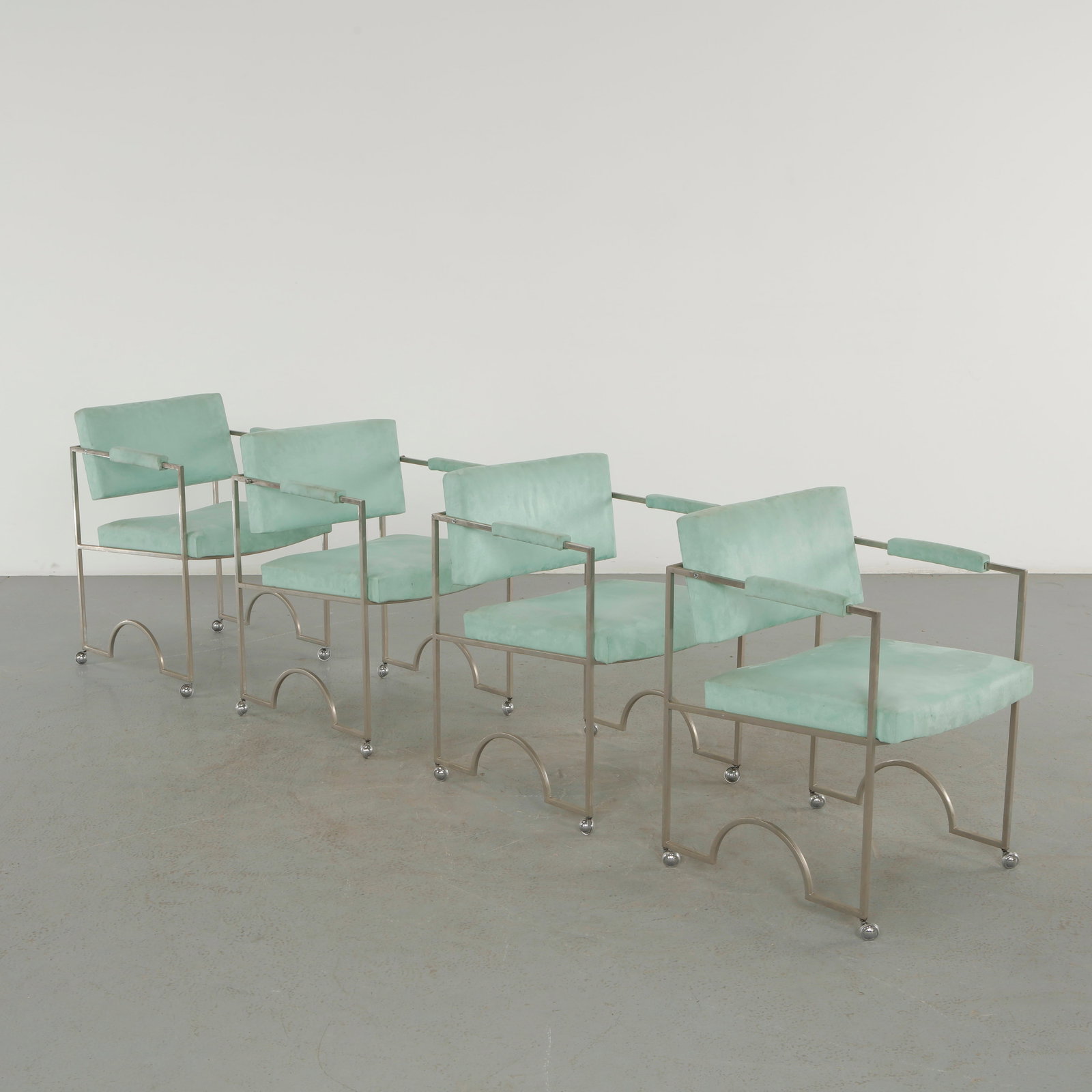 Charles Hollis, Set of Four Green Velvet Chairs, 1960s: Elegant set of four dining chairs featuring brushed metal frames and newly upholstered green velvet seats and backs. Their clean lines and sophisticated proportions reflect the enduring design of Char