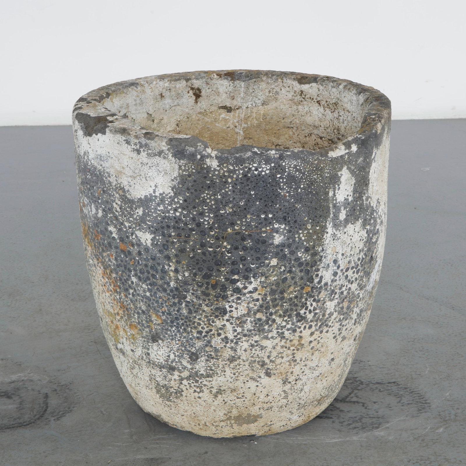 Antique Foundry Crucible Planter, 1960s: Former foundry crucible in refractory concrete, repurposed as a planter. Heavily weathered gray-white mineral patina built up over decades of use and heat exposure, with a flared form and thick walls.