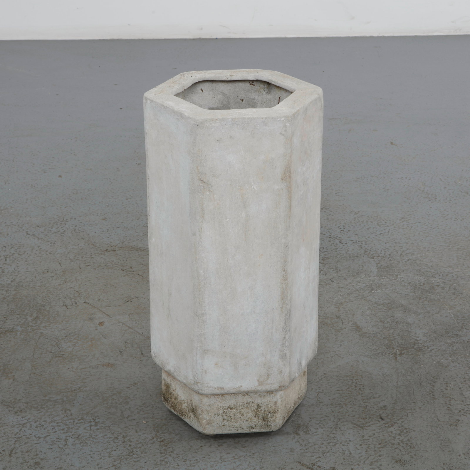 Willy Guhl, Tall Hexagonal Planters, 1960s: An architectural fiber cement planter featuring a distinctive hexagonal profile and clean geometric lines. Its sculptural form and weathered patina exemplify Willy Guhlâ€™s timeless approach t