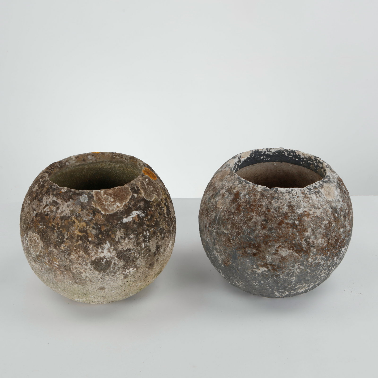Grandon Fres, Pair of Spherical Planters, 1960s: Pair of spherical planters with textured surface. Sculptural outdoor statement pieces by Grandon Fres. Height: 12 in. Diameter: 13 in. Opening Diameter: 8 in.