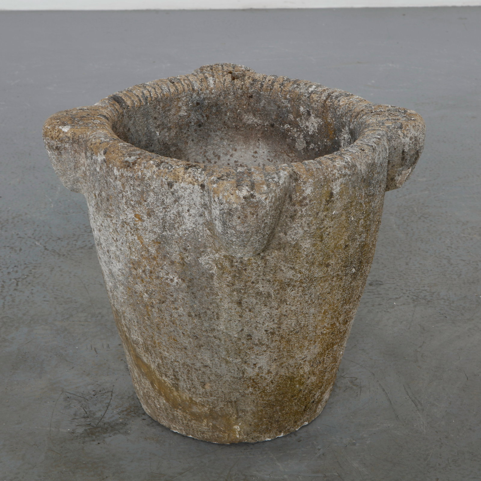 Large Stone Round Planter, 1960s: Carved from solid stone, this substantial round planter features a richly weathered surface and a timeless sculptural silhouette. A refined garden ornament that embodies the enduring character of Medi