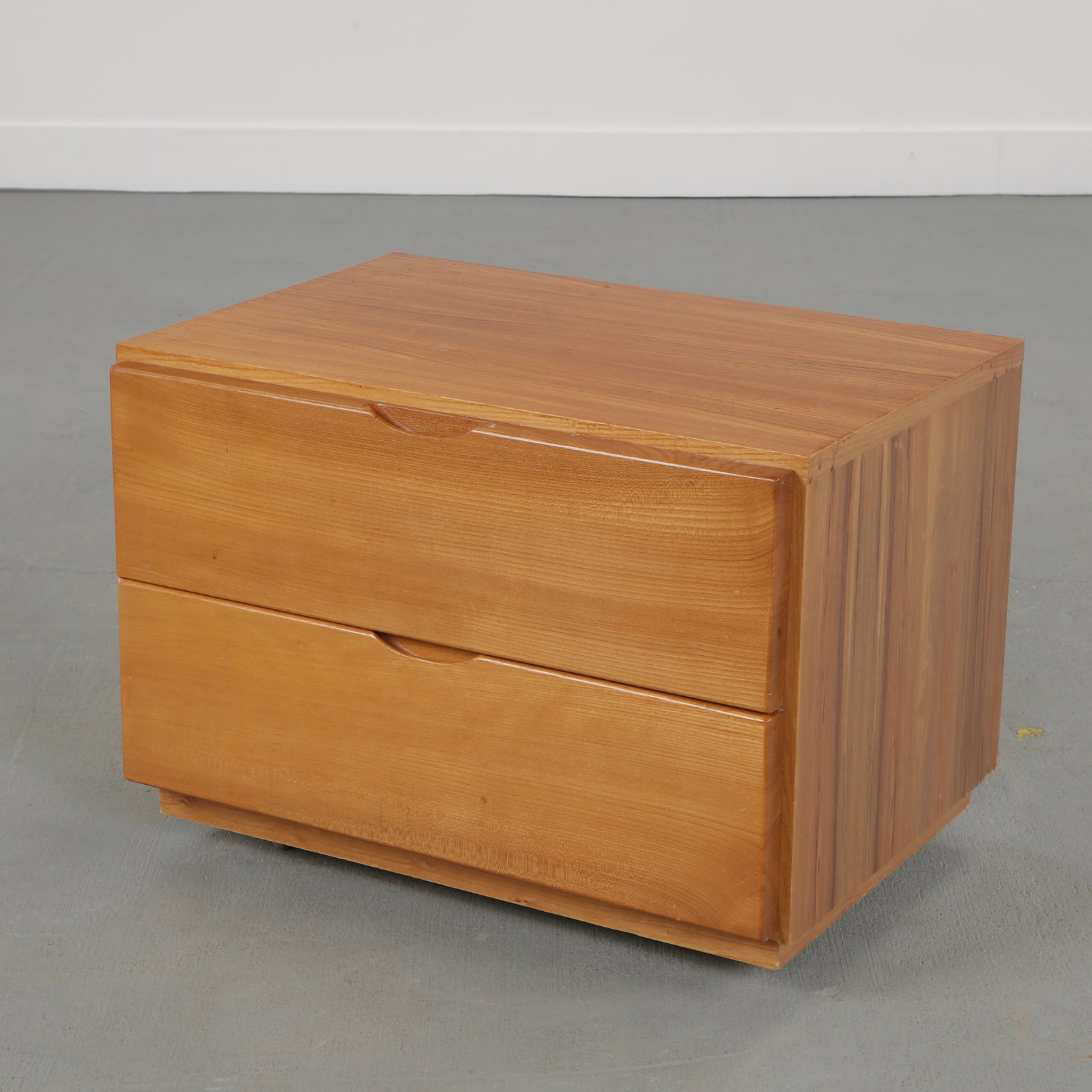 Maison Regain, Mid-Century Nightstand on Wheels, 1960s: Executed in solid wood with integrated pull handles and clean architectural lines. A practical and refined storage piece reflecting the restrained functionalism and craftsmanship of French