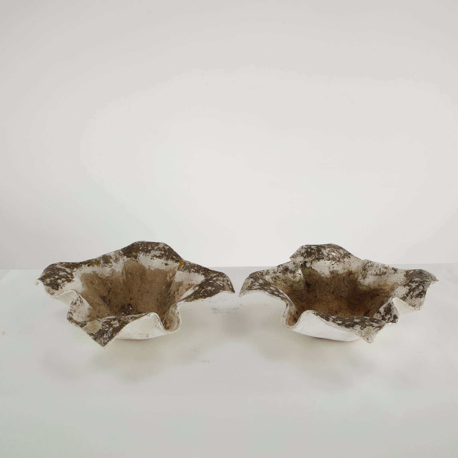 Willy Guhl, Pair of Small Elephant Ear Planters, 1960s: Pair of small Elephant Ear planters, also known as handkerchief planters, by Willy Guhl for Eternit, Switzerland circa 1960. Factory-drilled drainage holes. Wonderful patina. Width: 20 in. Length: 20 