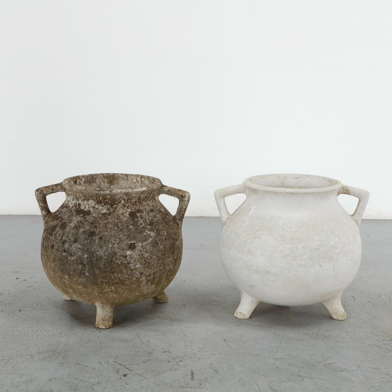 Willy Guhl, Pair of Cauldron Planters, 1960s: Rare cauldron planters by Willy Guhl, with rounded vessel-like shapes and strong sculptural presence. Aged surface adds rustic charm. Opening Diameter: 11 in. Overall Diameter: 21 in. Height: 18 in.