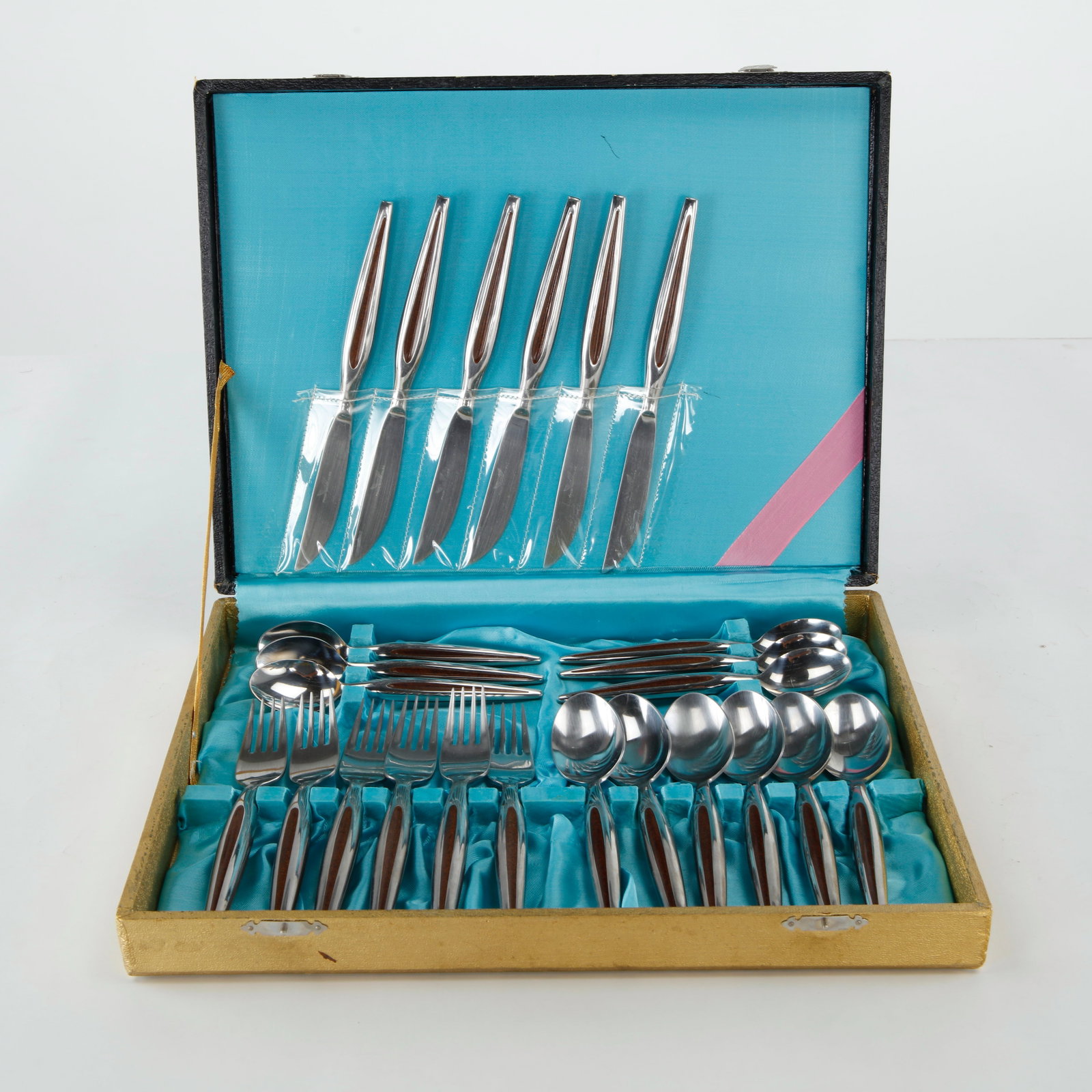 RTM Japan, Mid-Century Stainless Steel Flatware Set with Teak Handles, 1970s: A mid-century modern flatware set in stainless steel with sculpted teak handles, by RTM, Japan. Comprising 6 dinner forks, 6 dinner knives, 6 dinner spoons, and 6 teaspoons, in original fitted present