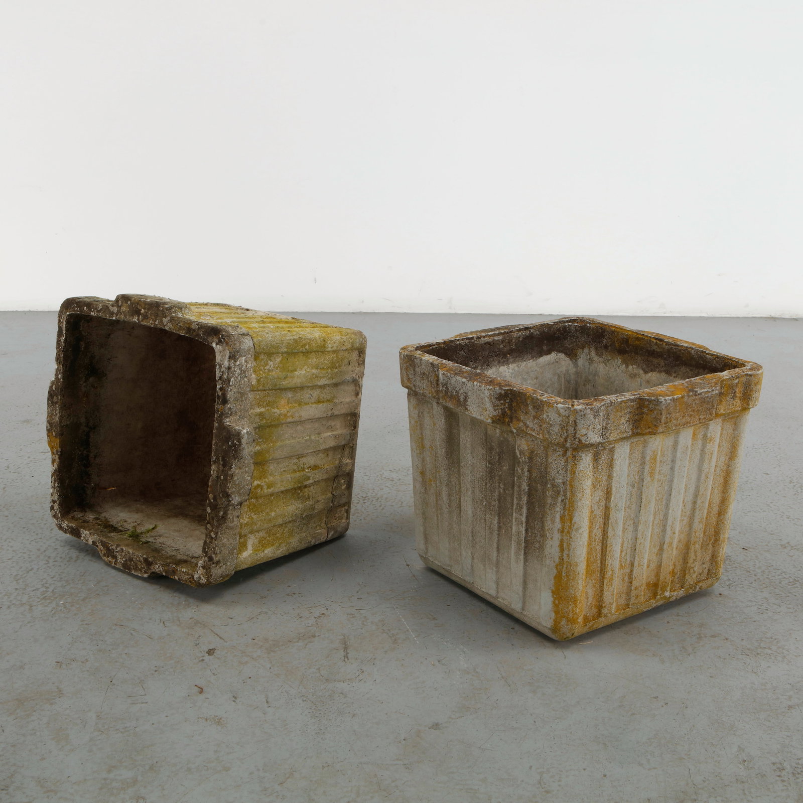 Willy Guhl, Pair of Square Planters, 1960s: Pair of square planters designed by Willy Guhl and produced by Eternit in molded fiber cement. The restrained geometry emphasizes the architectural clarity of the form while the naturally aged surface