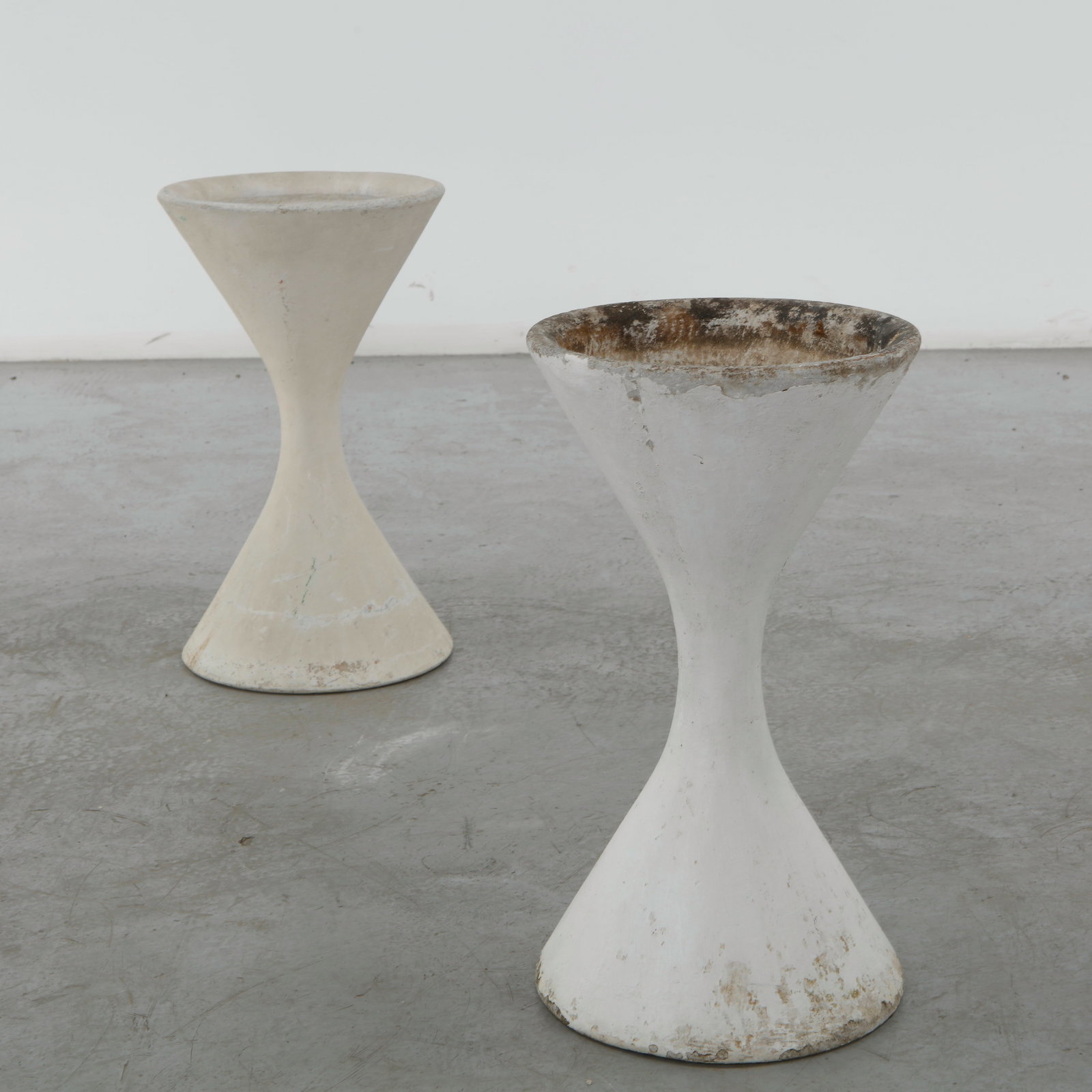 Willy Guhl, Pair of Extra Small Diabolo Planters, 1960s: Pair of Willy Guhl extra small diabolo planters manufactured by Eternit, Switzerland. Height: 19 in. Diameter: 11 in.