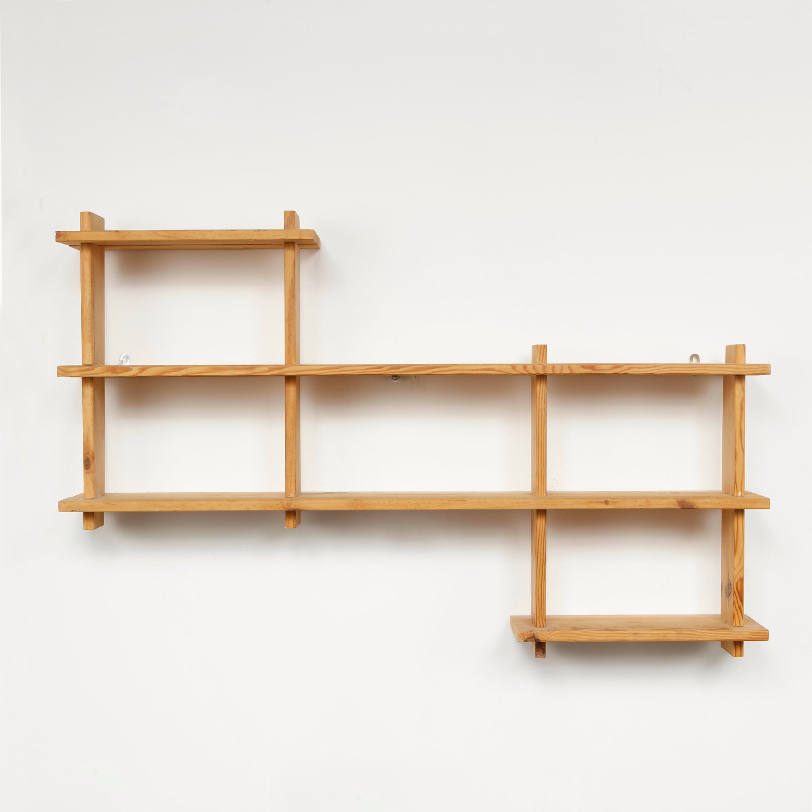 Pierre Gautier Delaye, Wood Shelf, 1960s: A sculptural wall shelf crafted from solid pine, featuring an open geometric composition inspired by the functional aesthetics of Charlotte Perriand. Its balanced proportions and natural materiality m